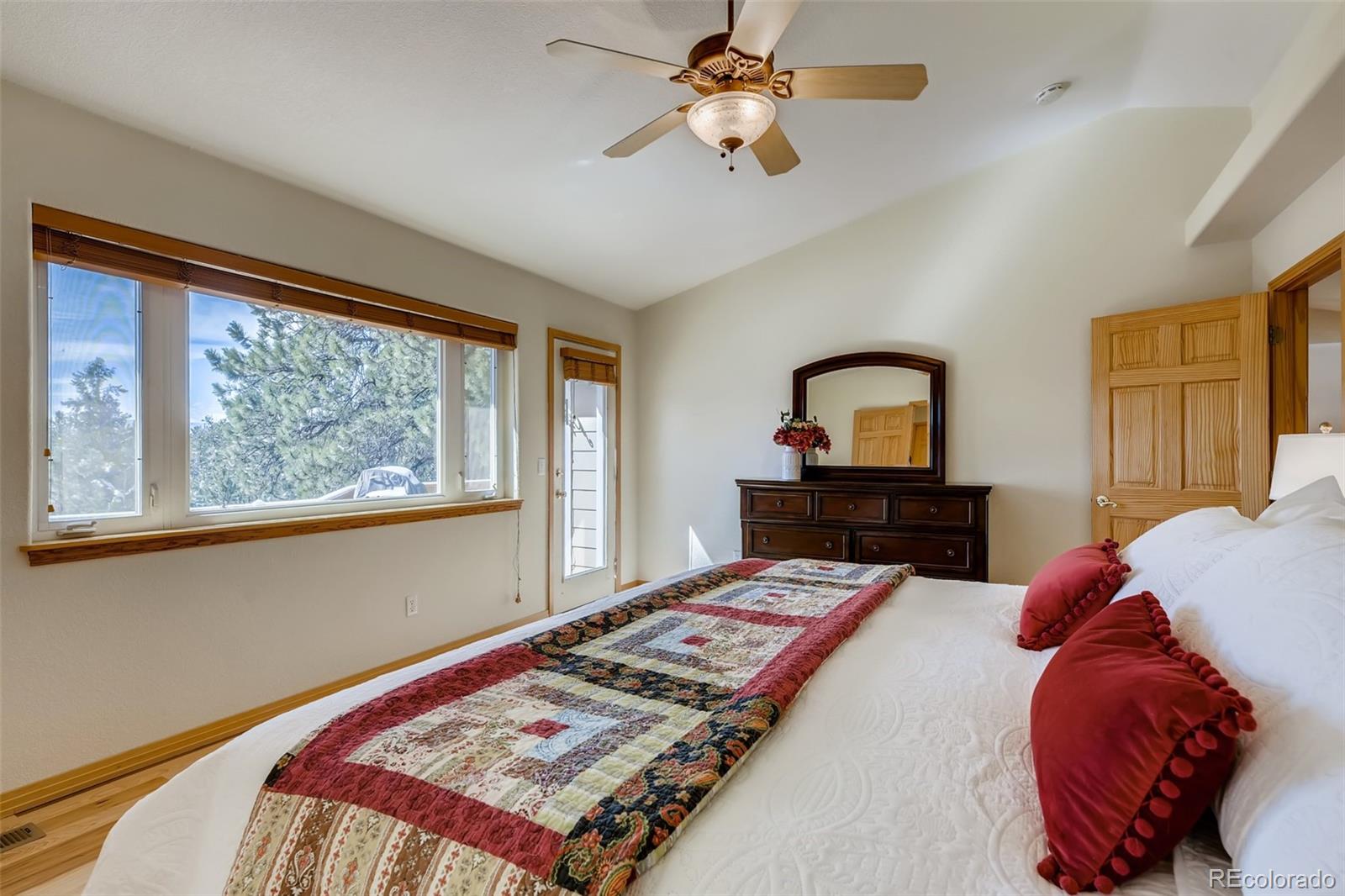 35681 Upper Aspen Lane Pine, CO 80470 - Photo 14 of 36 a bedroom with a bed and window