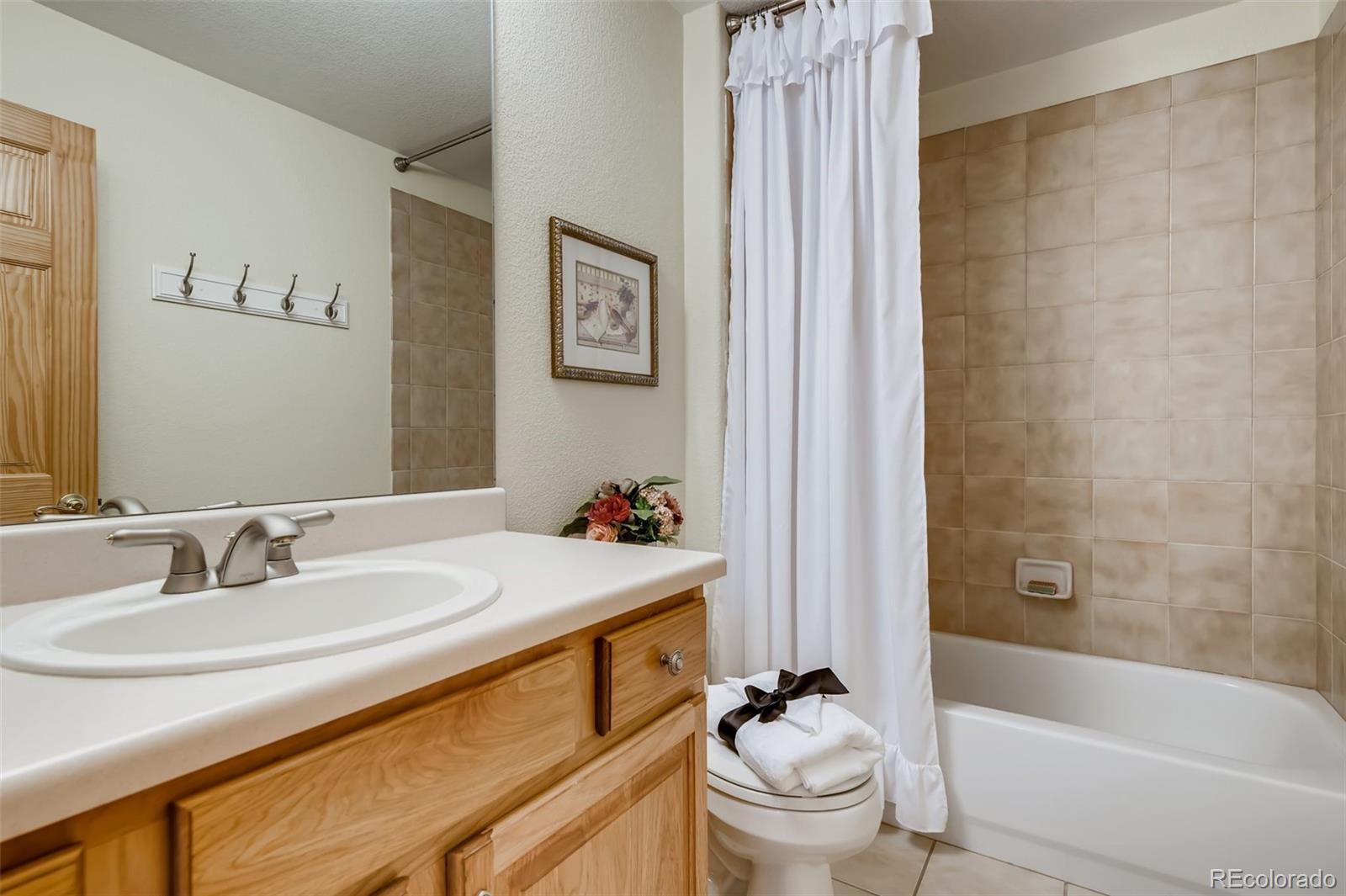 35681 Upper Aspen Lane Pine, CO 80470 - Photo 19 of 36 a bathroom with a sink a toilet and a bathtub
