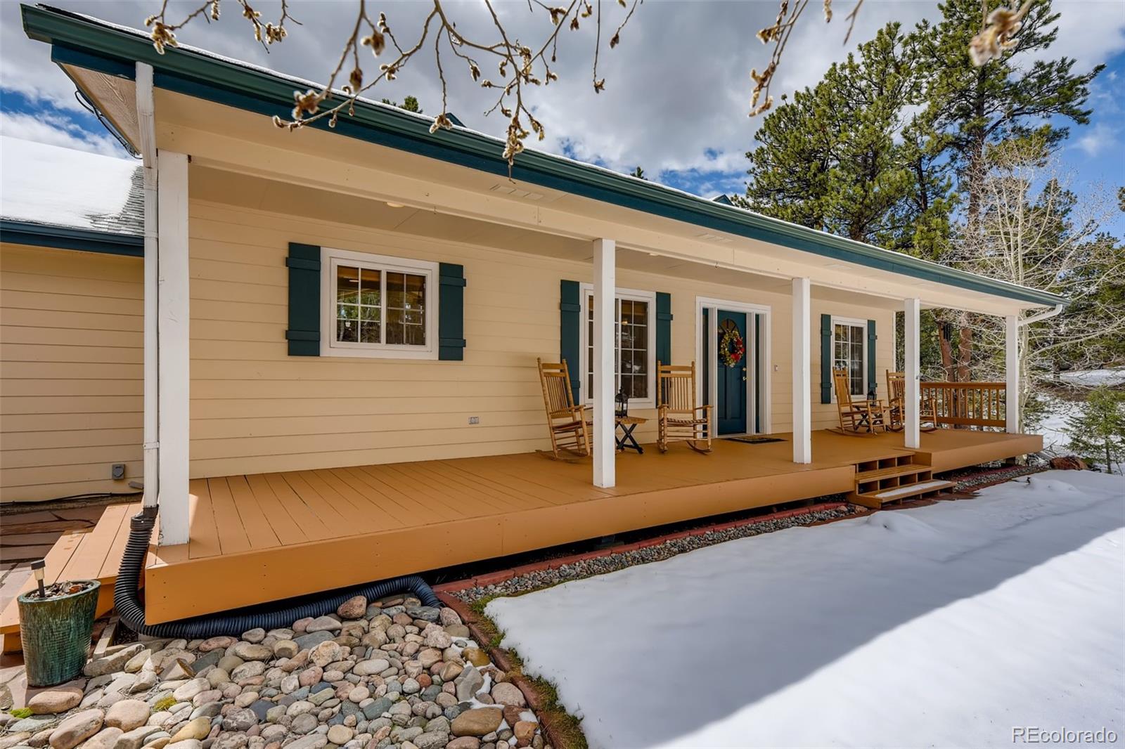 35681 Upper Aspen Lane Pine, CO 80470 - Photo 2 of 36 a view of a house with backyard