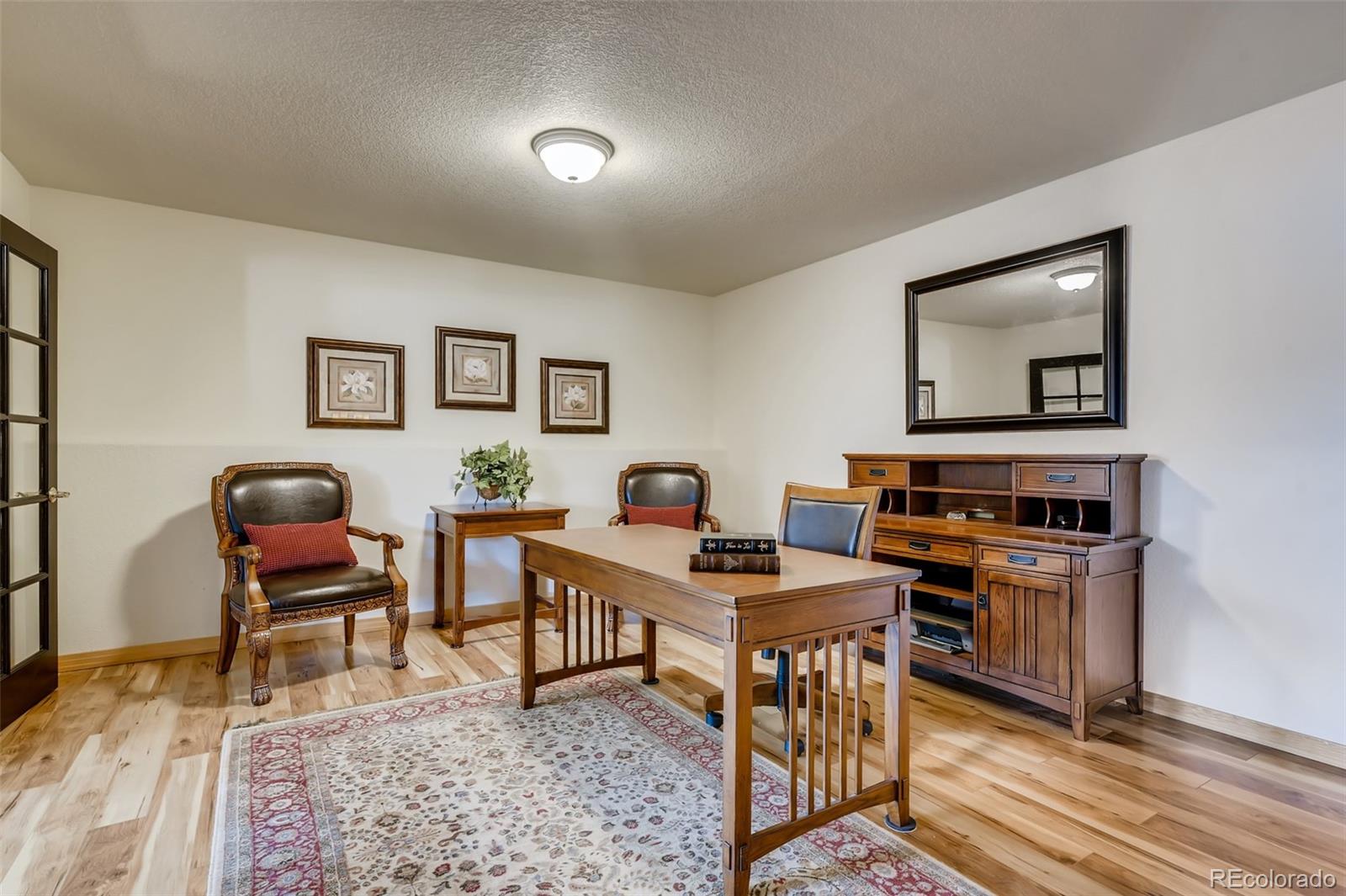 35681 Upper Aspen Lane Pine, CO 80470 - Photo 23 of 36 a workspace with furniture and wooden floor