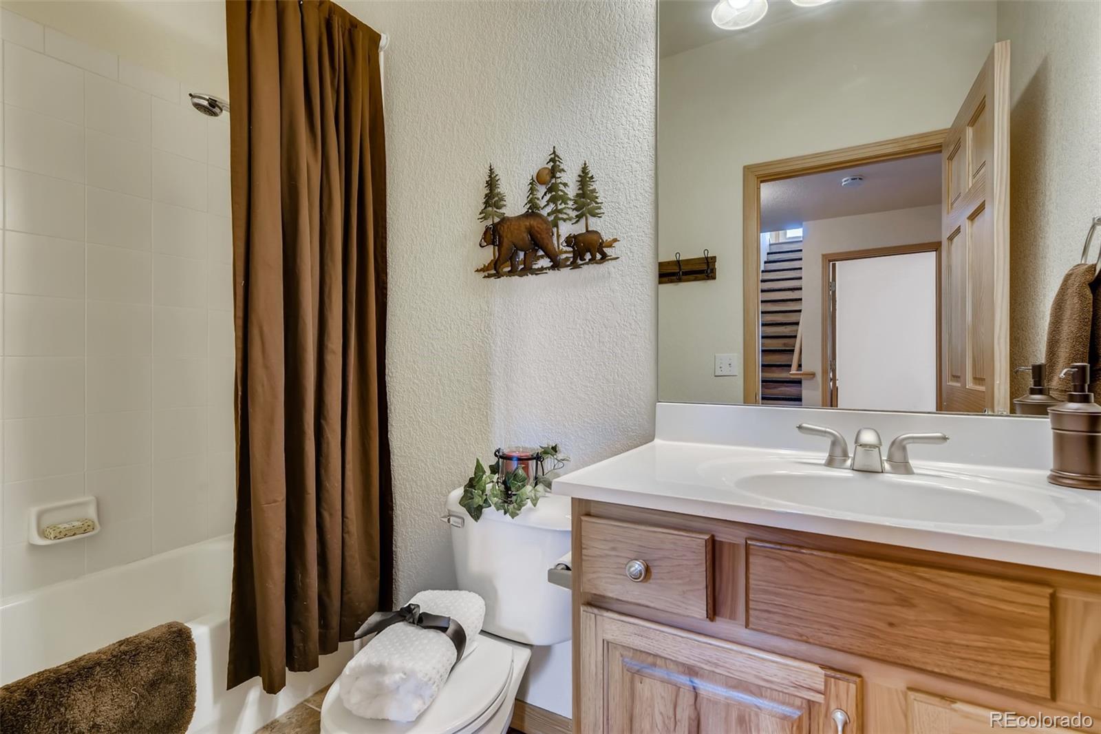 35681 Upper Aspen Lane Pine, CO 80470 - Photo 25 of 36 a bathroom with a sink vanity granite and toilet