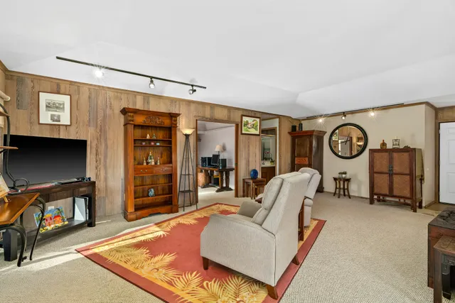 a spacious bedroom with a bed and a large window