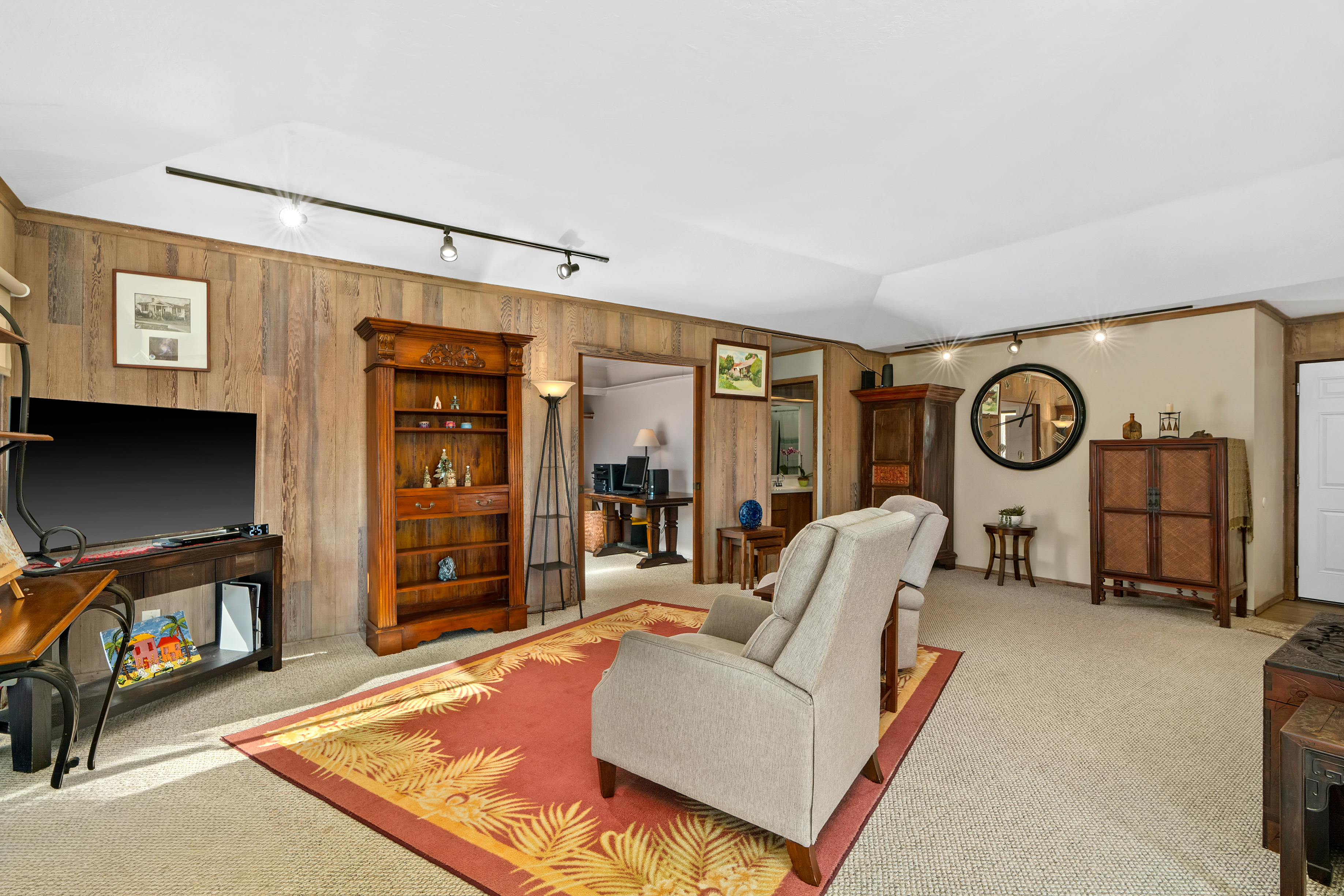 3587 Kaloke Street Kalaheo, HI 96741 - Photo 12 of 30 a living room with furniture and a flat screen tv