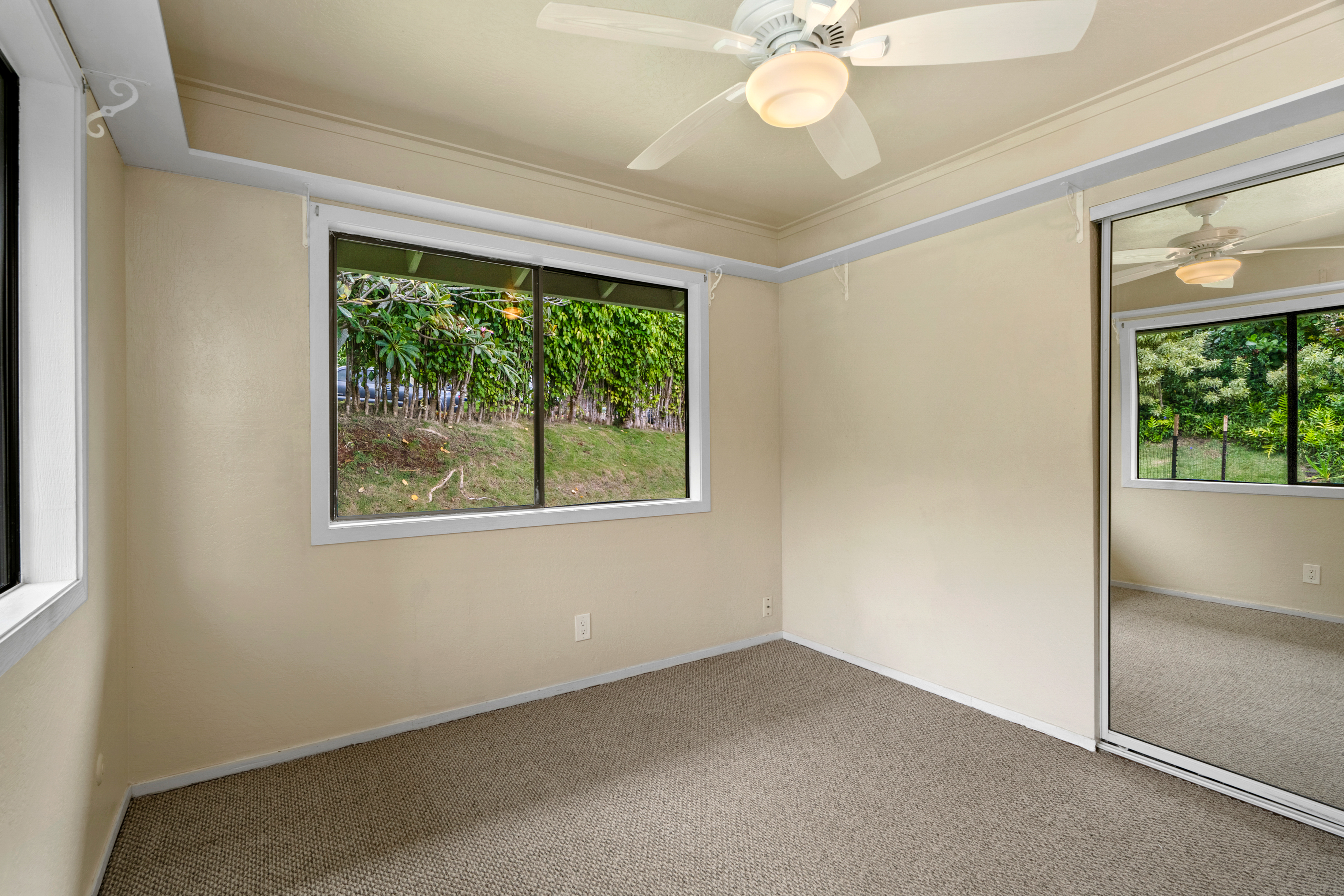 3587 Kaloke Street Kalaheo, HI 96741 - Photo 19 of 30 an empty room with a window