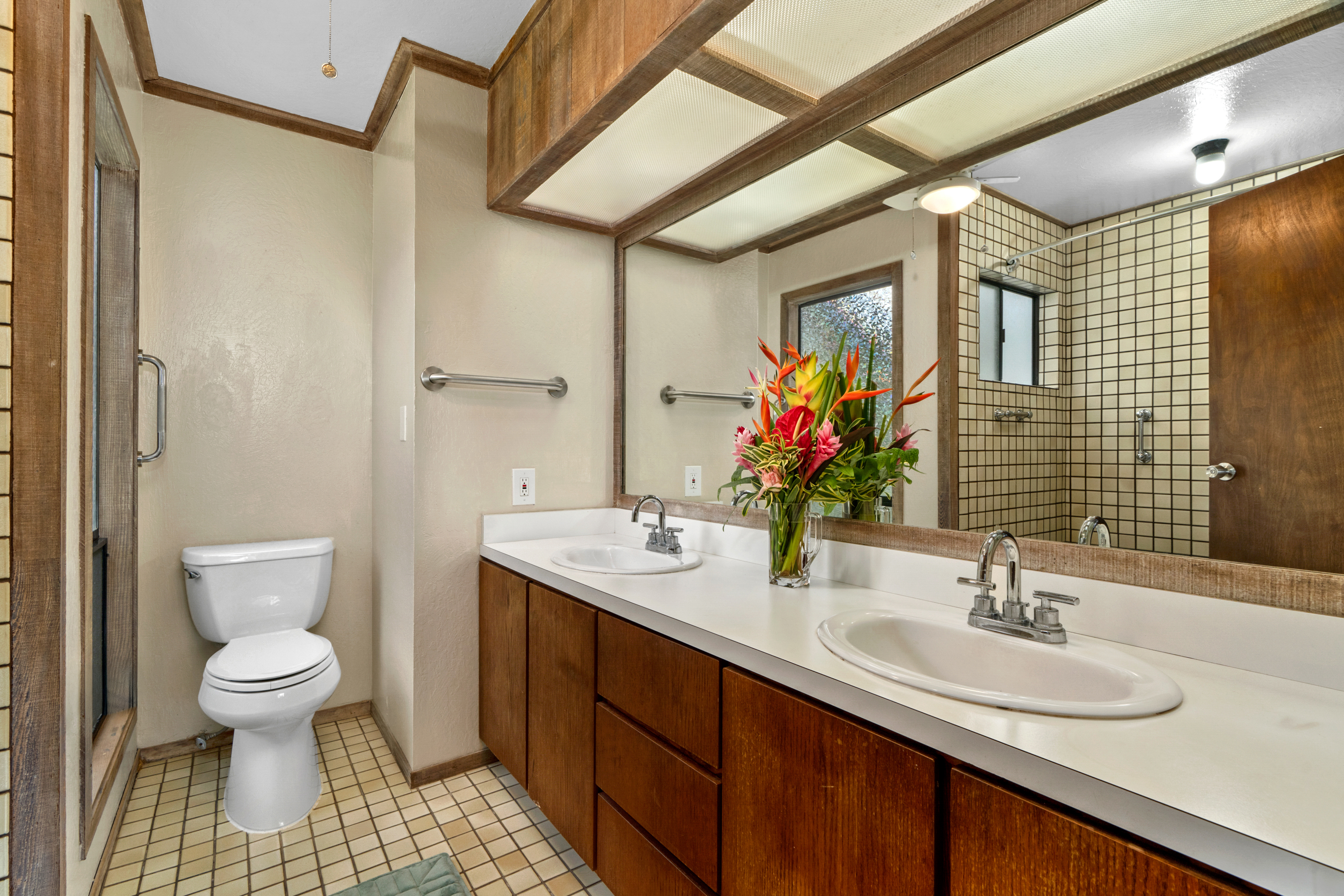 3587 Kaloke Street Kalaheo, HI 96741 - Photo 21 of 30 a bathroom with a sink and a mirror