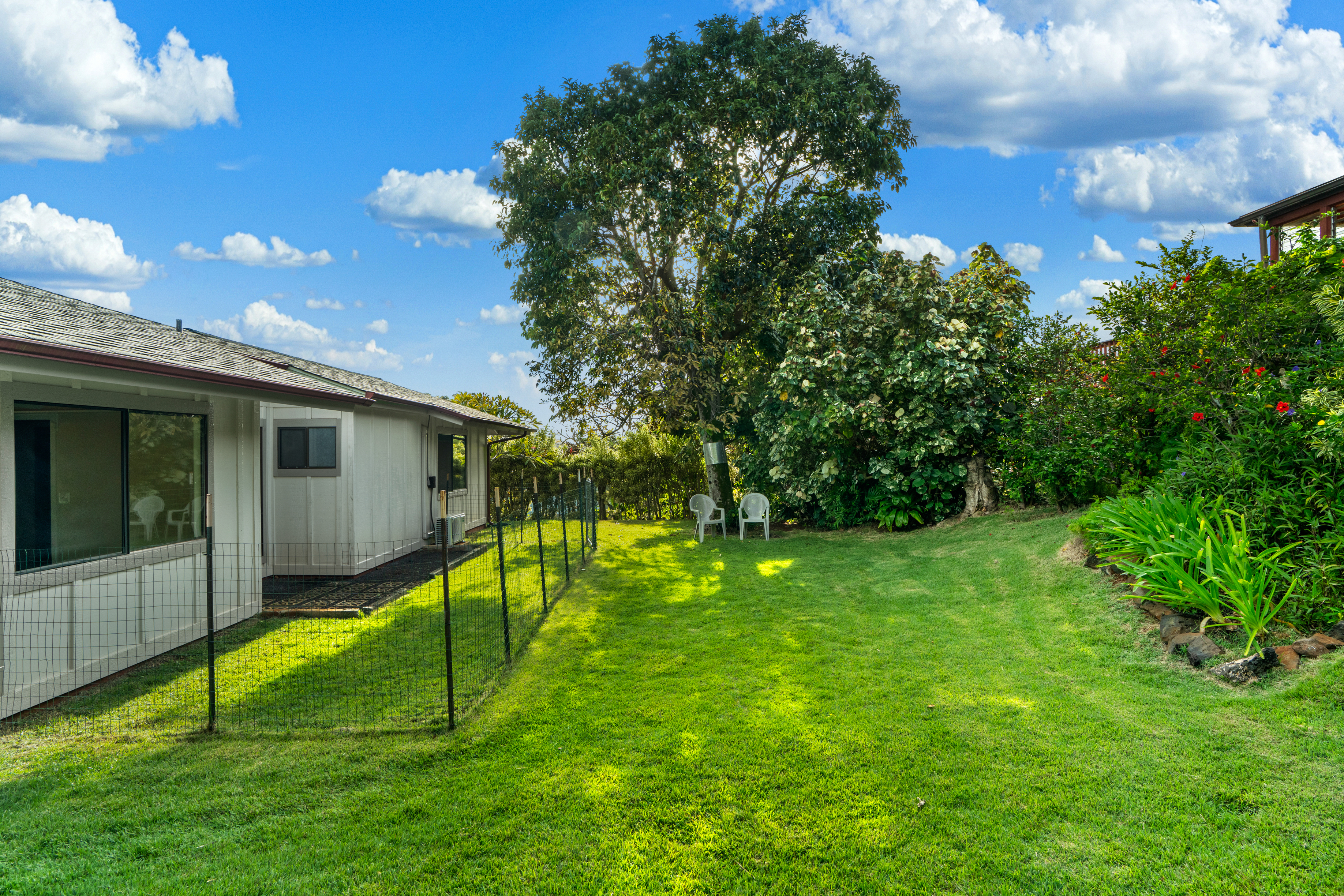 3587 Kaloke Street Kalaheo, HI 96741 - Photo 23 of 30 a view of an house with backyard space and balcony