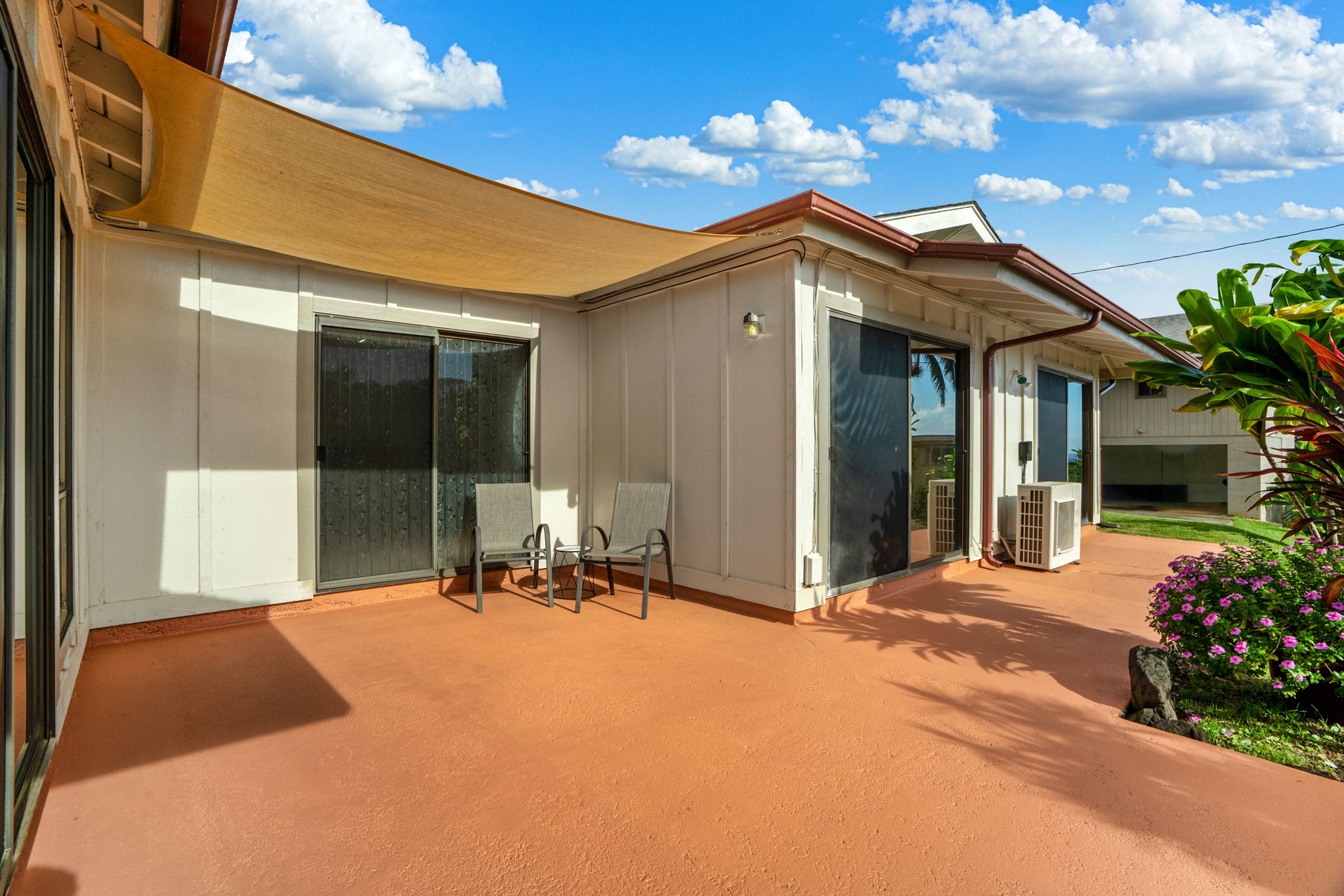 3587 Kaloke Street Kalaheo, HI 96741 - Photo 4 of 30 a front view of a house with a garden