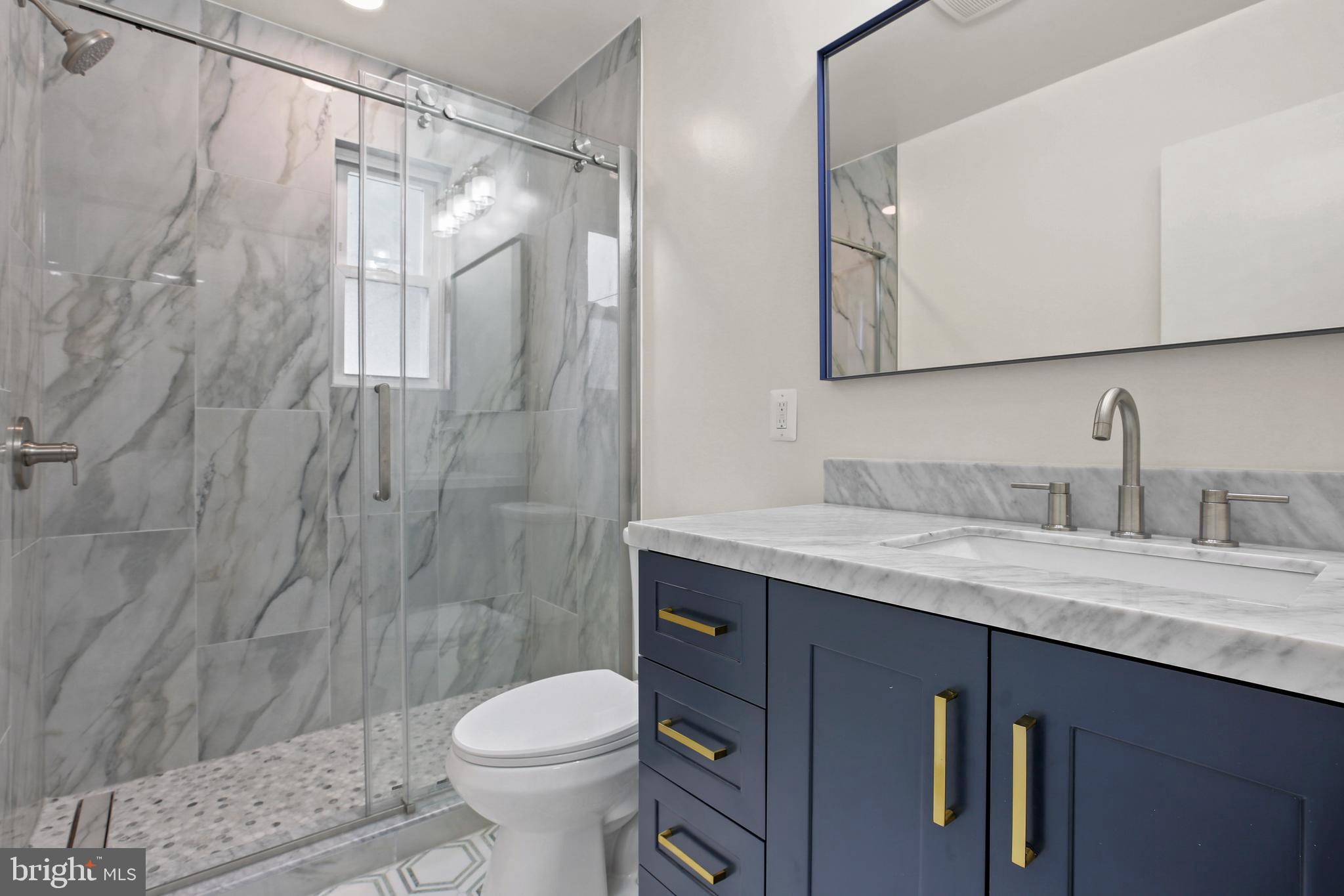 1445 Northgate Road Northwest Washington, DC 20012 - Photo 11 of 20 a bathroom with a granite countertop sink toilet and shower