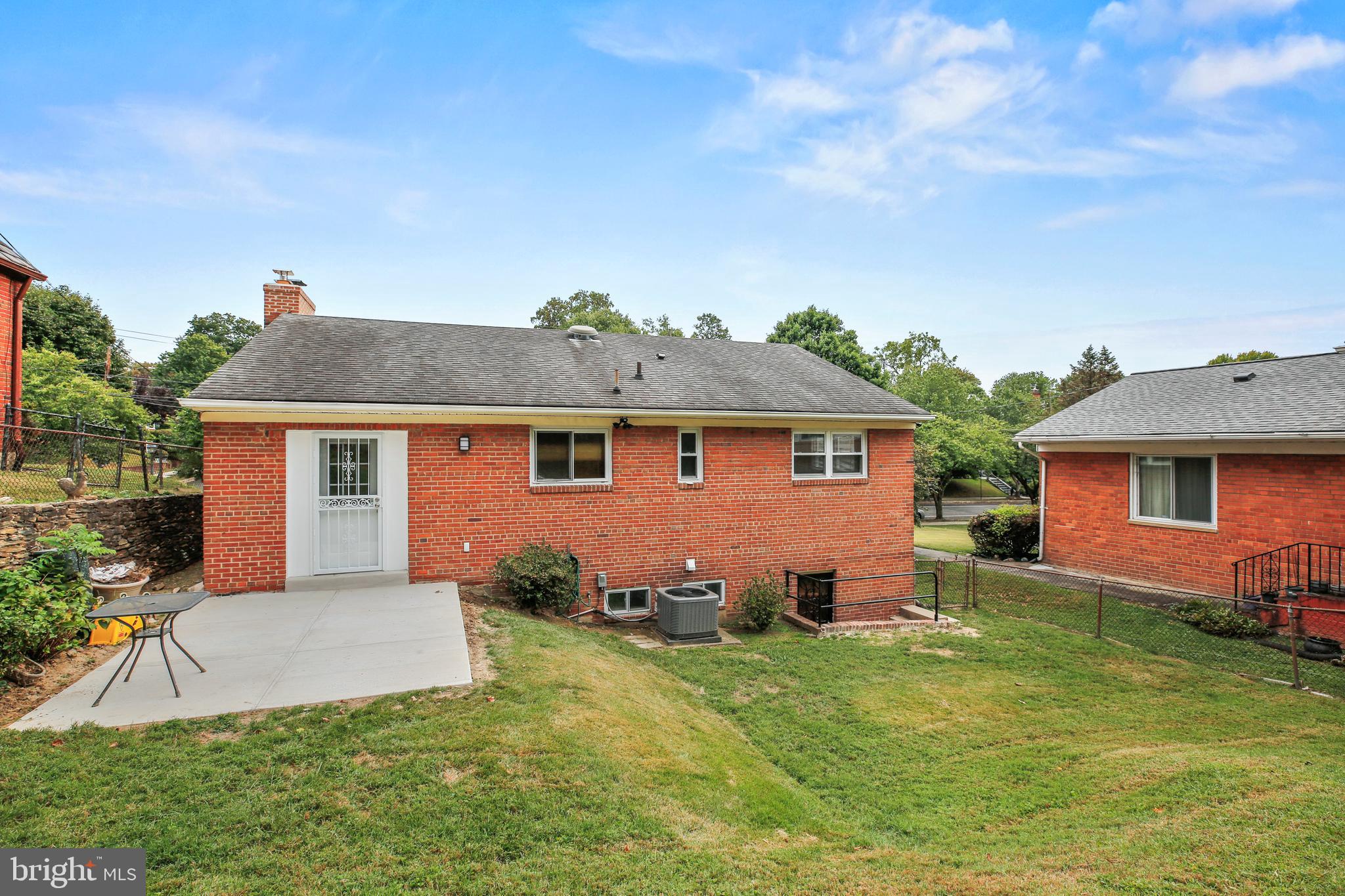 1445 Northgate Road Northwest Washington, DC 20012 - Photo 13 of 20 front view of a house with a yard