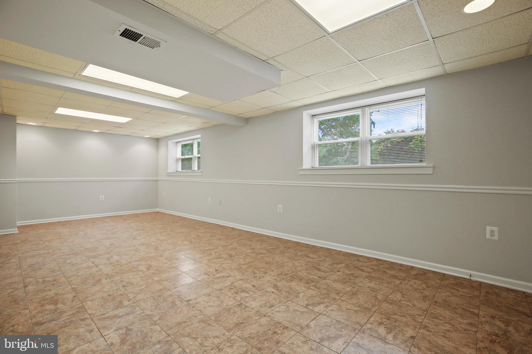 1445 Northgate Road Northwest Washington, DC 20012 - Photo 16 of 20 an empty room with a empty space and windows
