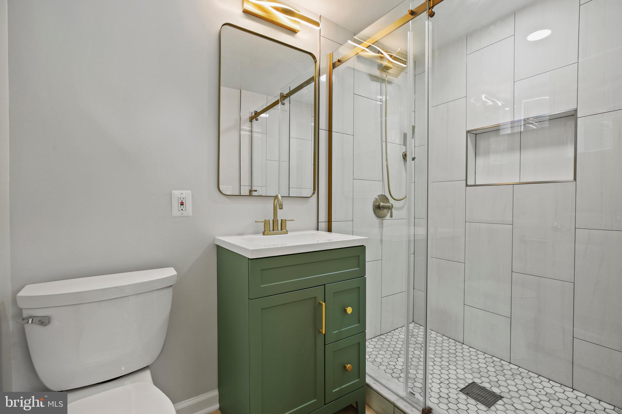 1445 Northgate Road Northwest Washington, DC 20012 - Photo 17 of 20 a bathroom with a toilet sink and shower