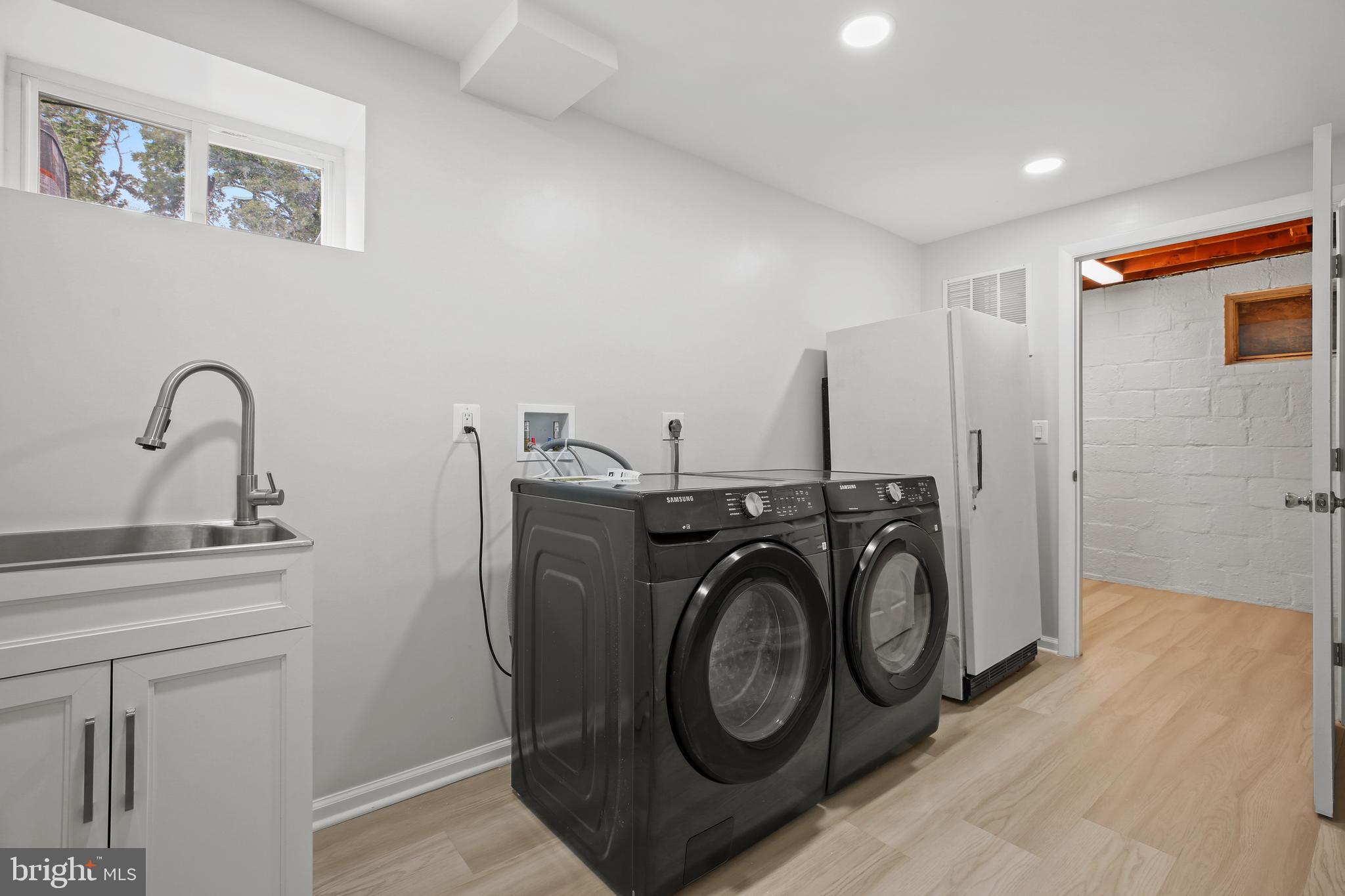 1445 Northgate Road Northwest Washington, DC 20012 - Photo 20 of 20 a utility room with sink dryer and washer