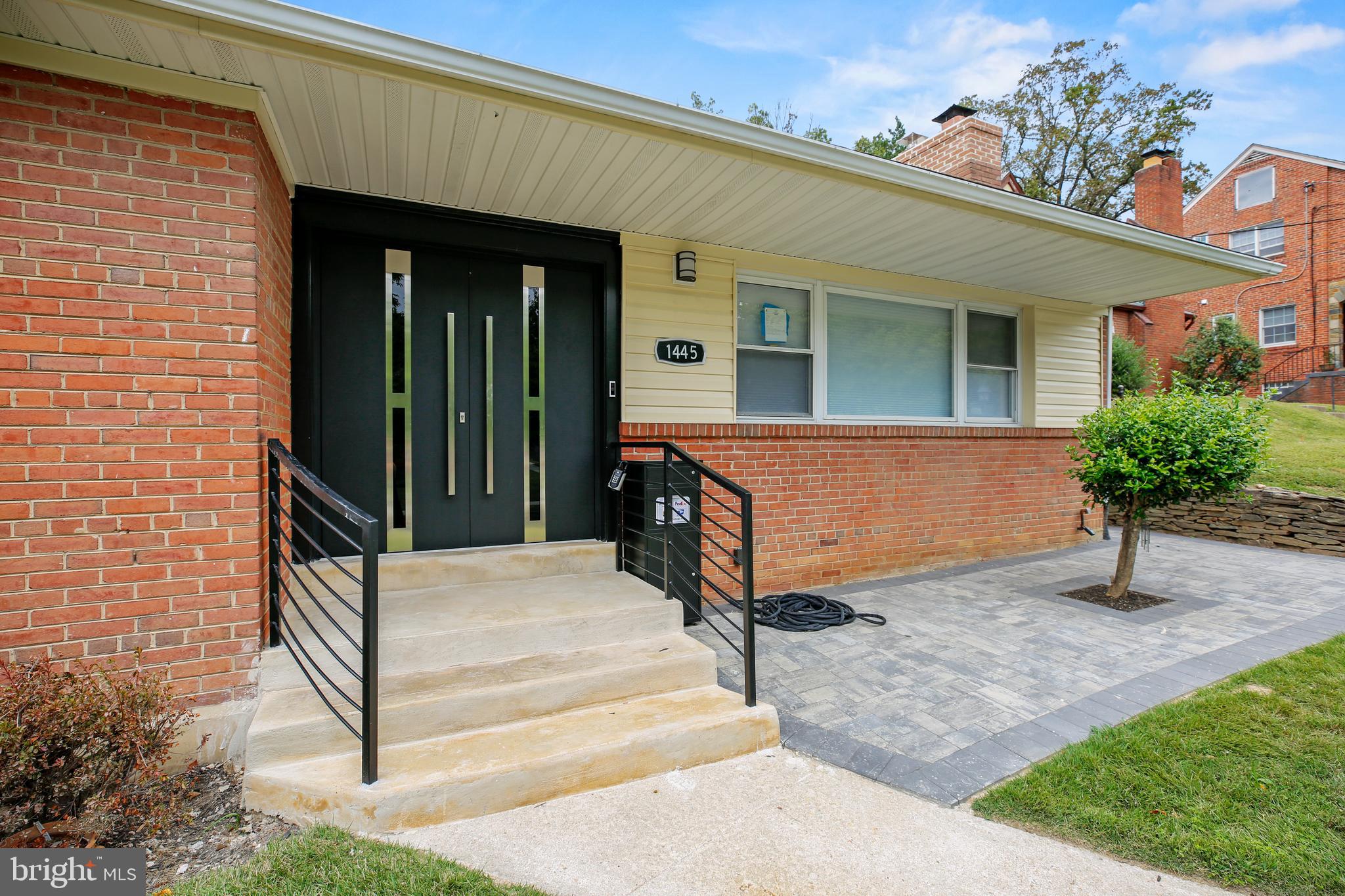 1445 Northgate Road Northwest Washington, DC 20012 - Photo 2 of 20 a front view of a house with garden