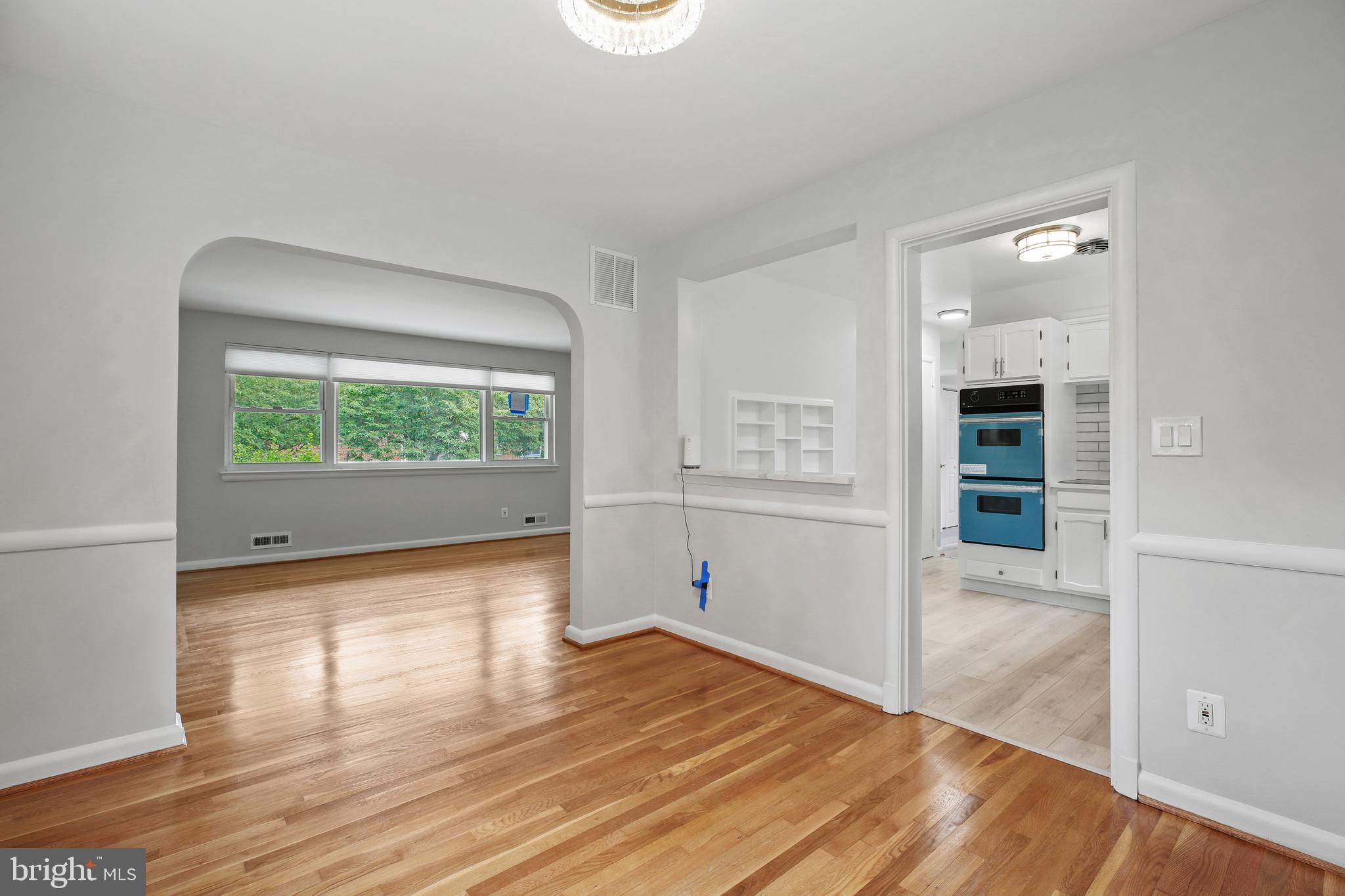 1445 Northgate Road Northwest Washington, DC 20012 - Photo 7 of 20 wooden floor in an empty room with a window