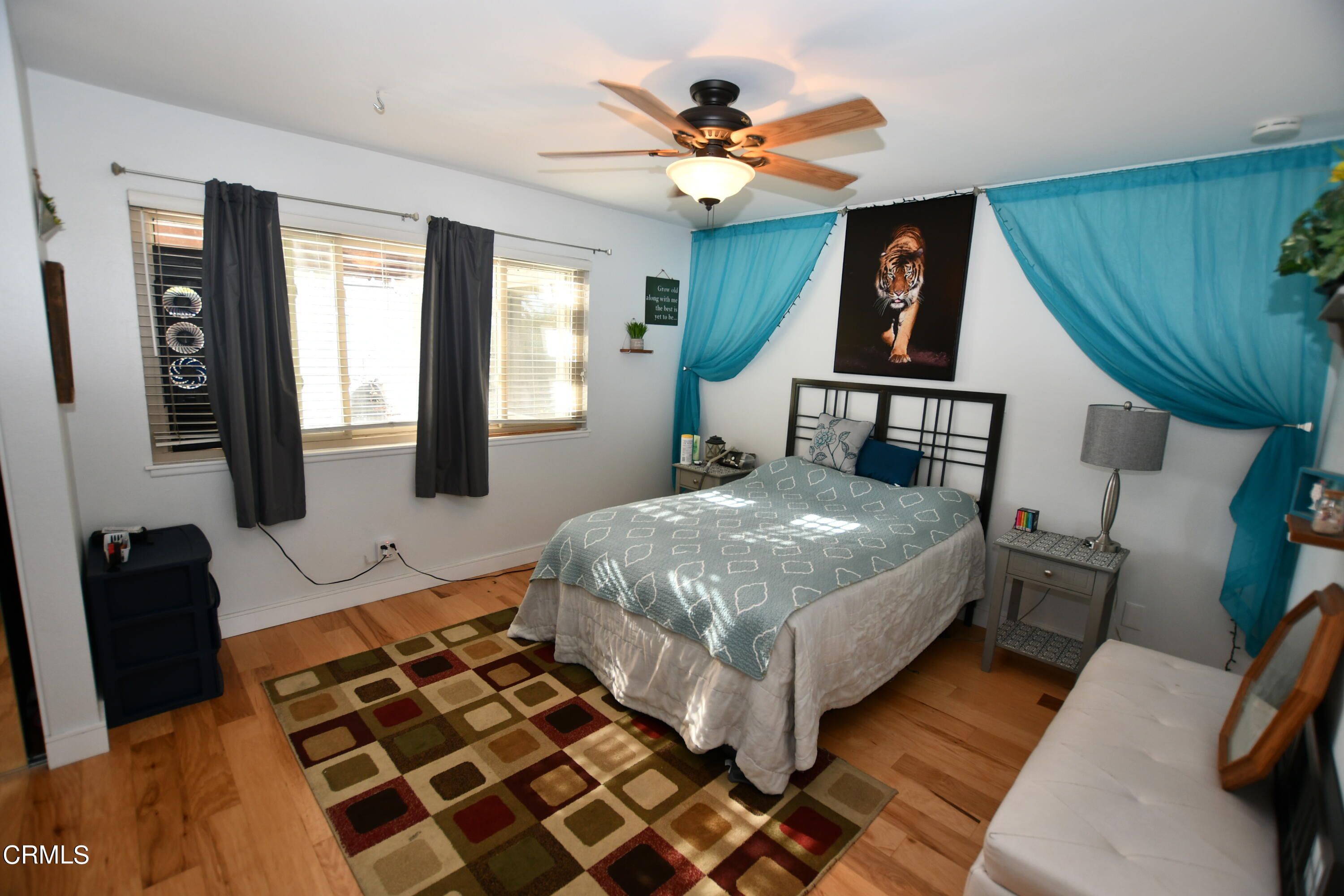 1711 Masthead Drive Oxnard, CA 93035 - Photo 11 of 18 a bedroom with a bed mirror and a window