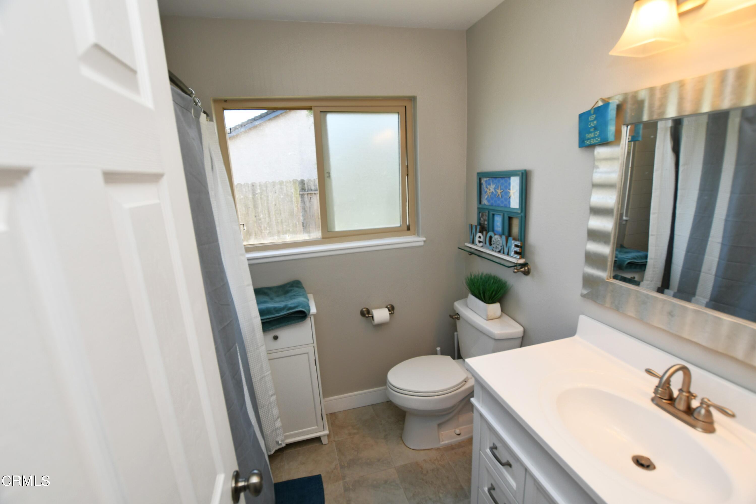1711 Masthead Drive Oxnard, CA 93035 - Photo 12 of 18 a bathroom with a sink toilet and shower