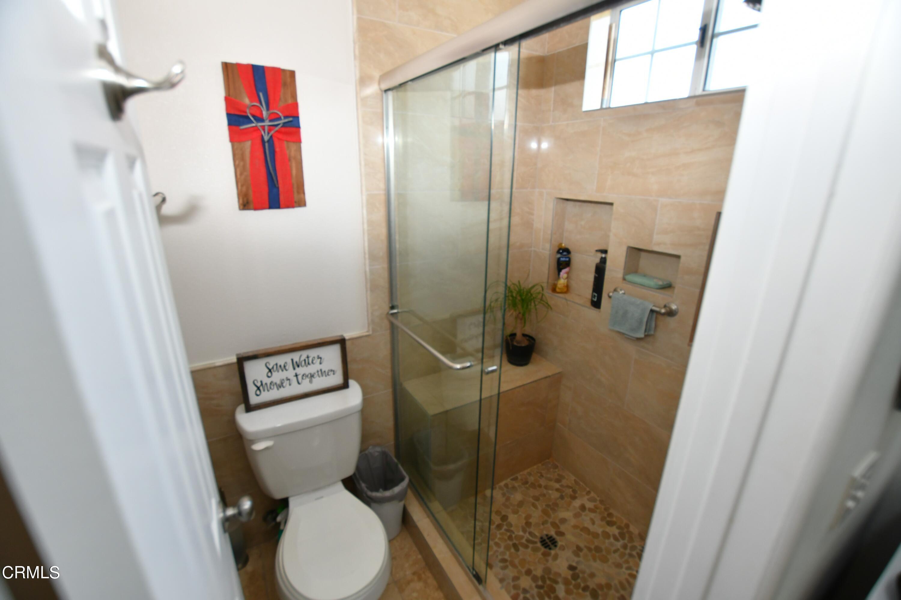 1711 Masthead Drive Oxnard, CA 93035 - Photo 13 of 18 a bathroom with a toilet and a shower