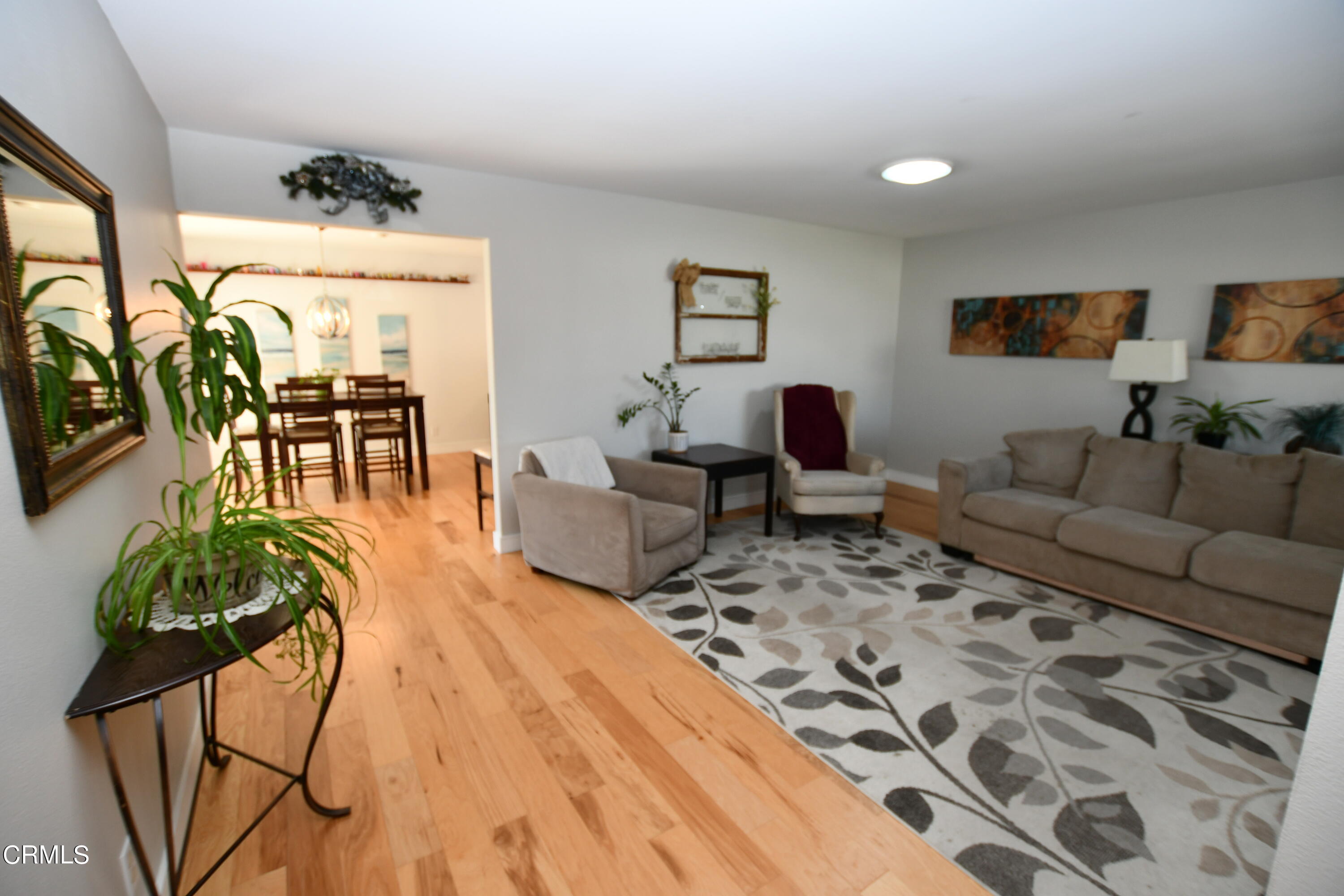 1711 Masthead Drive Oxnard, CA 93035 - Photo 3 of 18 a living room with furniture and a flat screen tv