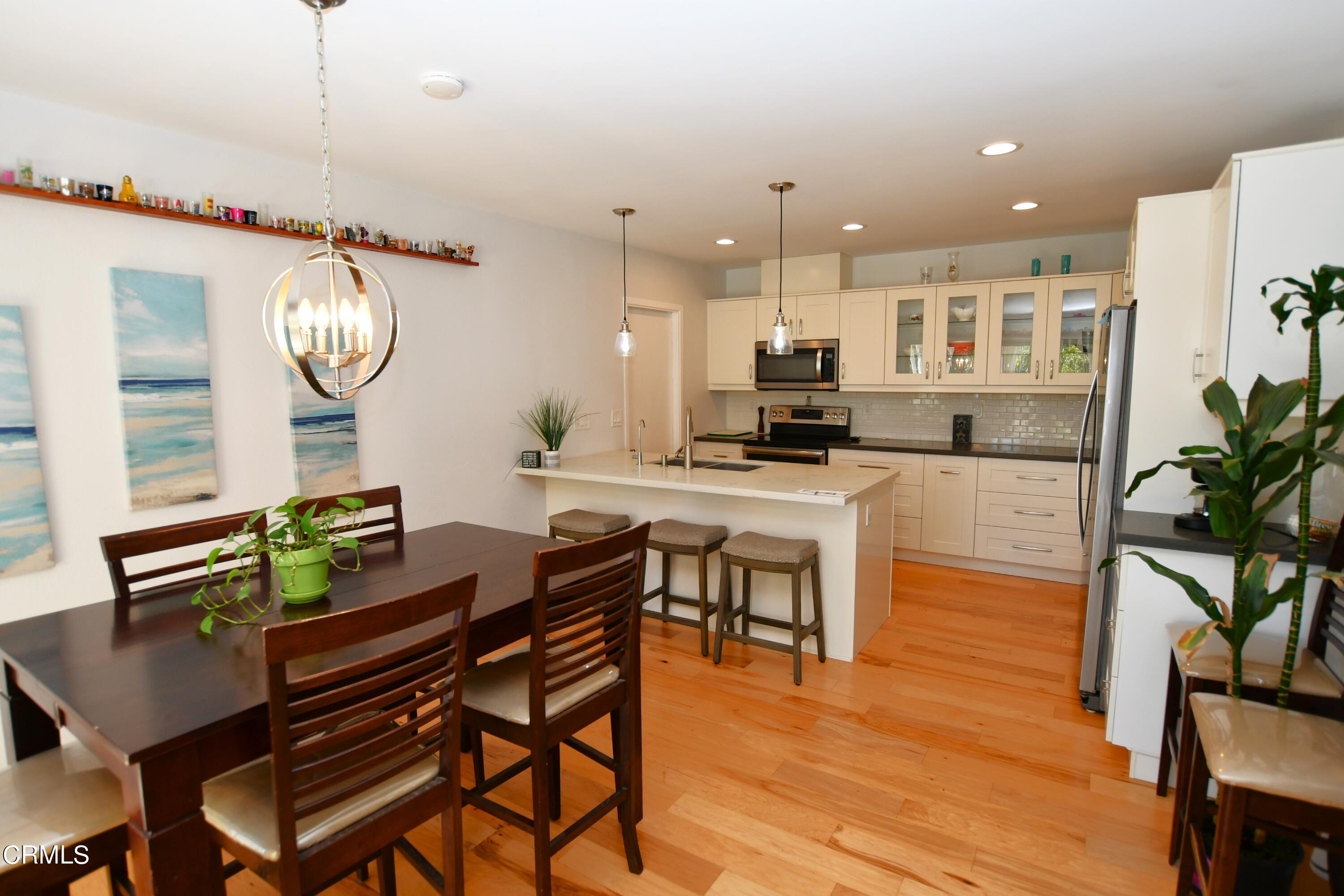 1711 Masthead Drive Oxnard, CA 93035 - Photo 4 of 18 a kitchen with a table and chairs in it