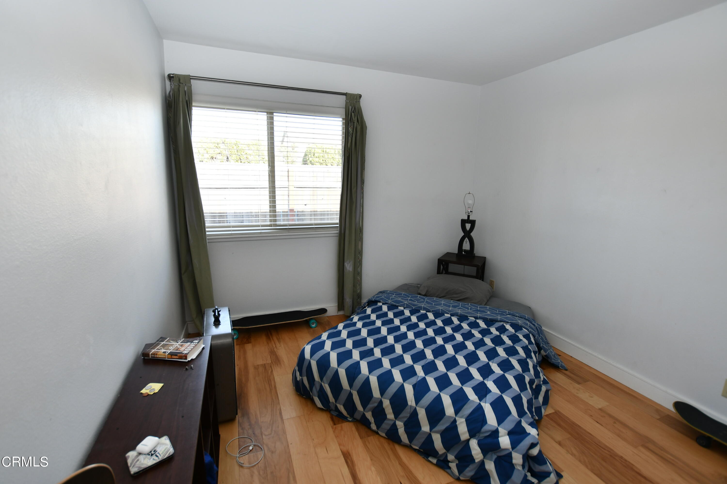 1711 Masthead Drive Oxnard, CA 93035 - Photo 9 of 18 a bedroom with a bed and window