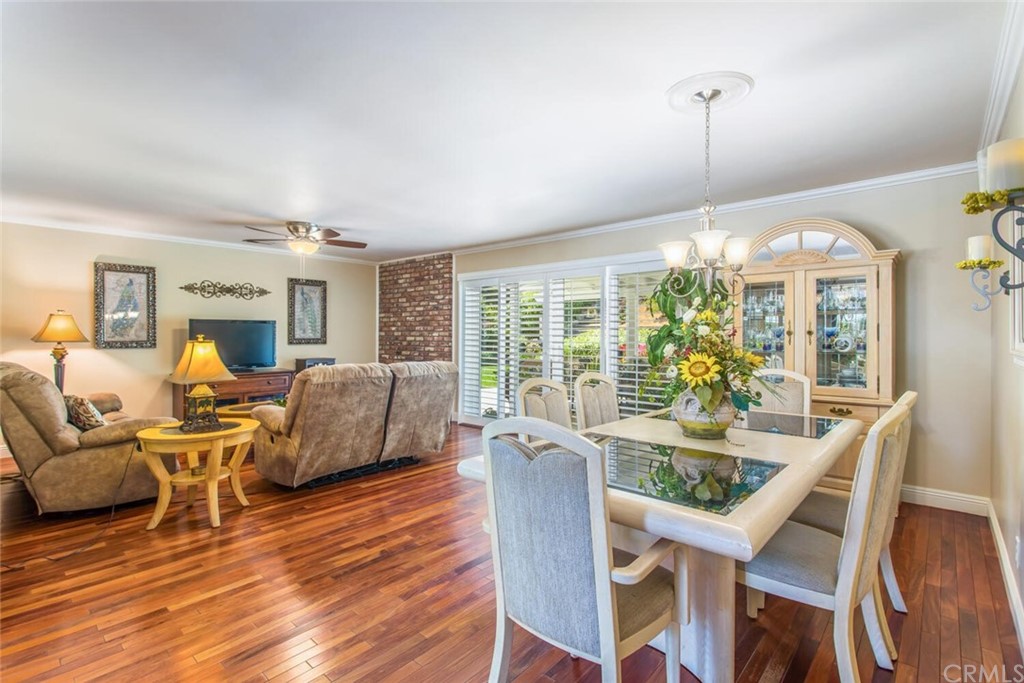 602 Juniper Court Redlands, CA 92374 - Photo 15 of 38 a view of a dining room with furniture window and wooden floor