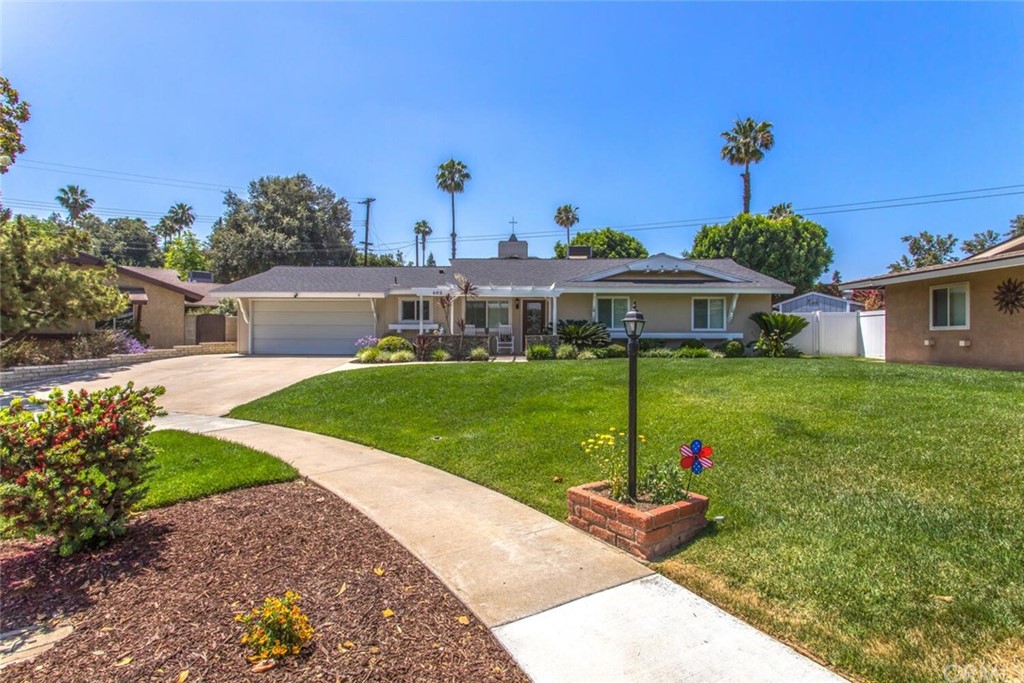 602 Juniper Court Redlands, CA 92374 - Photo 2 of 38 a front view of a house with a yard