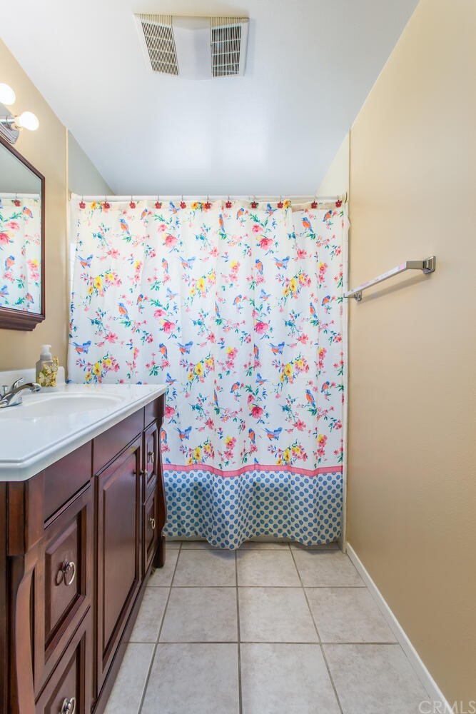 602 Juniper Court Redlands, CA 92374 - Photo 26 of 38 a bathroom with a sink a vanity and a shower