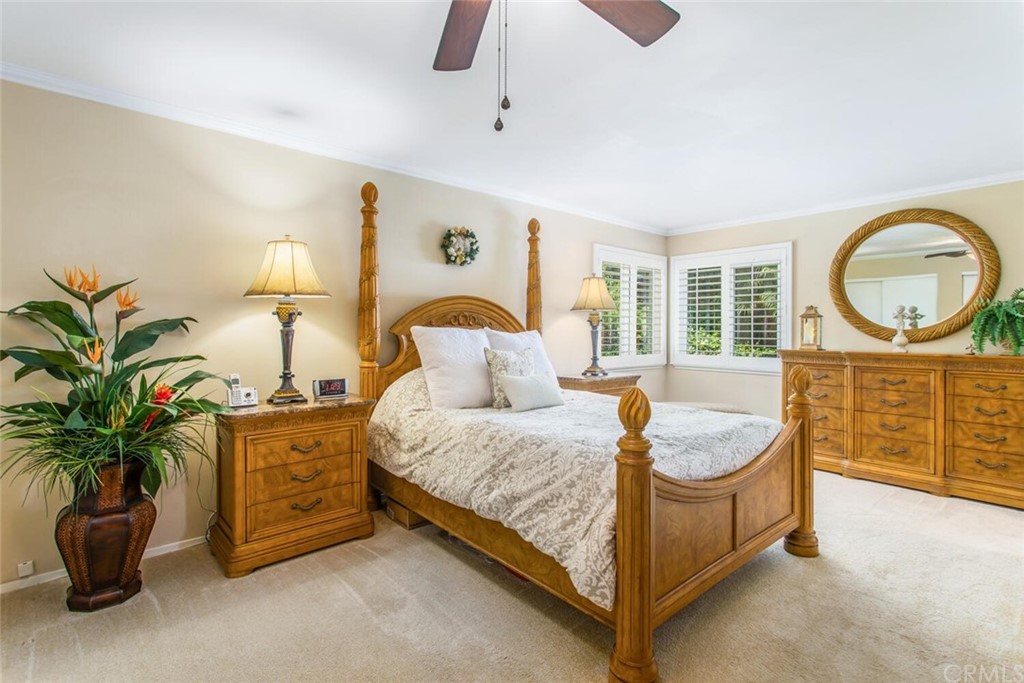 602 Juniper Court Redlands, CA 92374 - Photo 27 of 38 a bedroom with bed and a potted plant