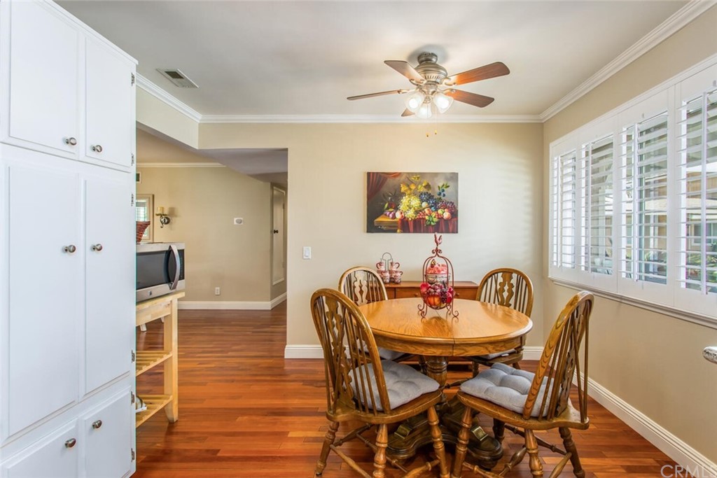 602 Juniper Court Redlands, CA 92374 - Photo 9 of 38 a dining room with furniture a window and wooden floor
