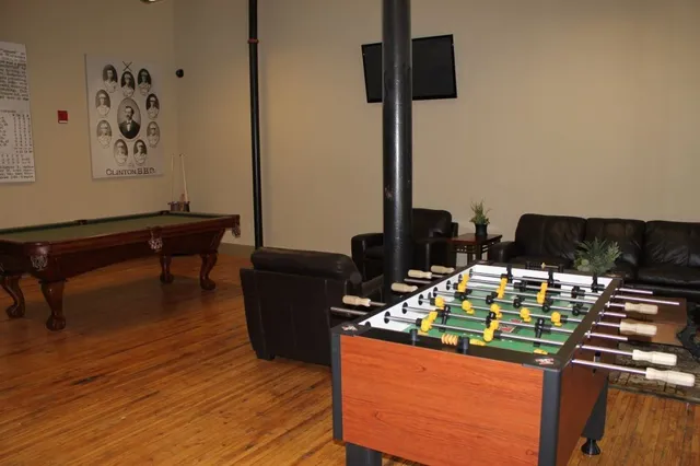 a living room with furniture and flat screen tv