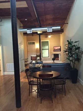 a dining room with furniture and window