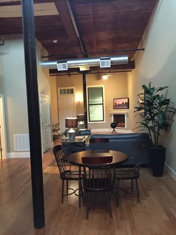 a dining room with furniture and window