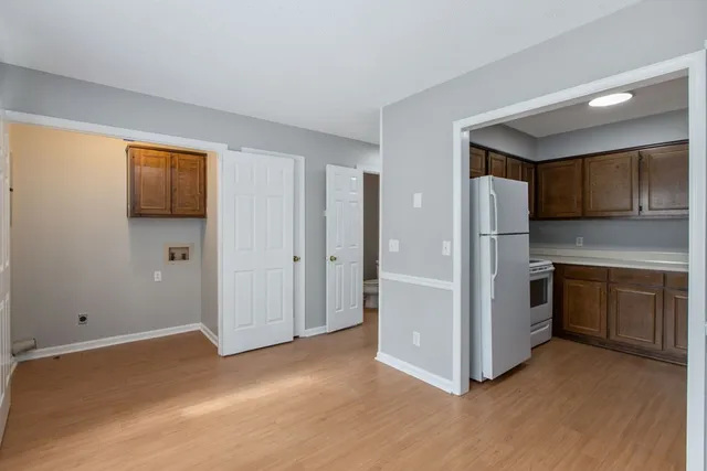 a kitchen with stainless steel appliances a refrigerator and a stove top oven