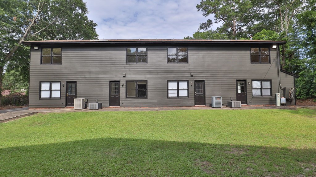 3660 Maryland Circle, Unit C Columbus, GA 31907 - Photo 20 of 21 a brick house with a yard in front of it