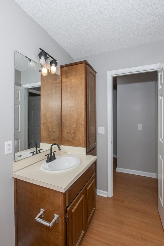 3660 Maryland Circle, Unit C Columbus, GA 31907 - Photo 7 of 21 a bathroom with a sink and a mirror