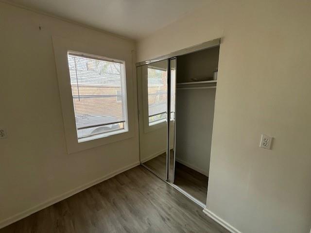1119 Canton Road Marietta, GA 30066 - Photo 9 of 10 a view of an empty room with wooden floor and a window