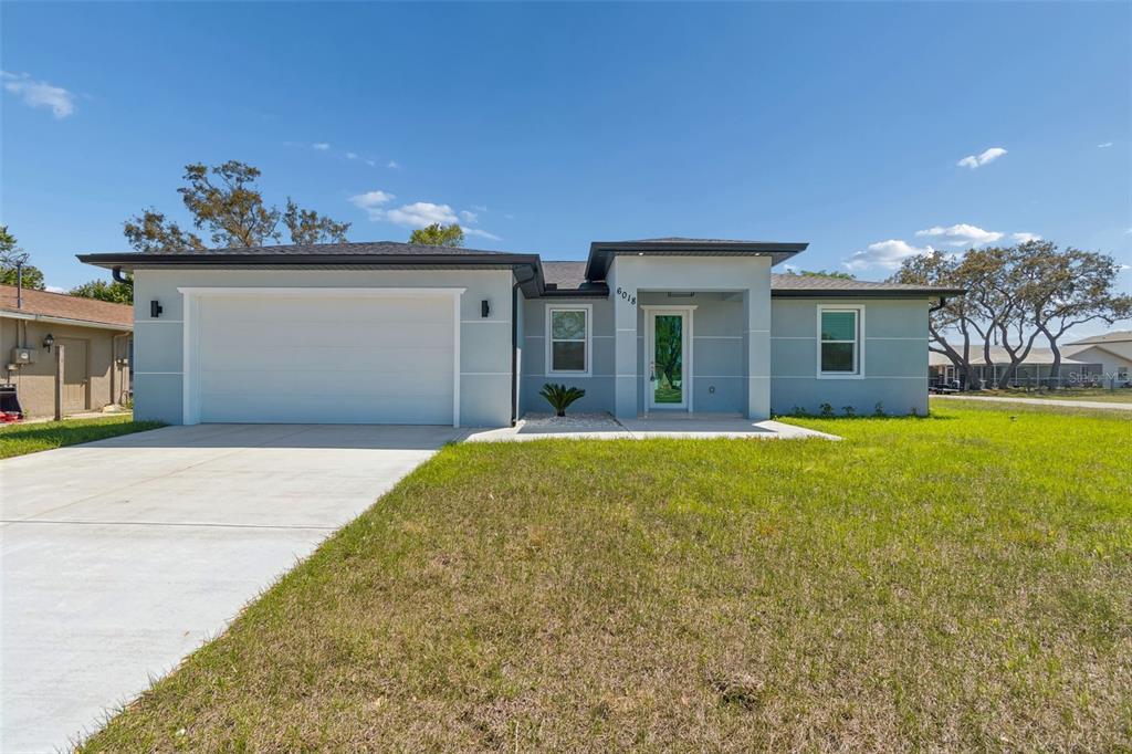 a house view with a garden space