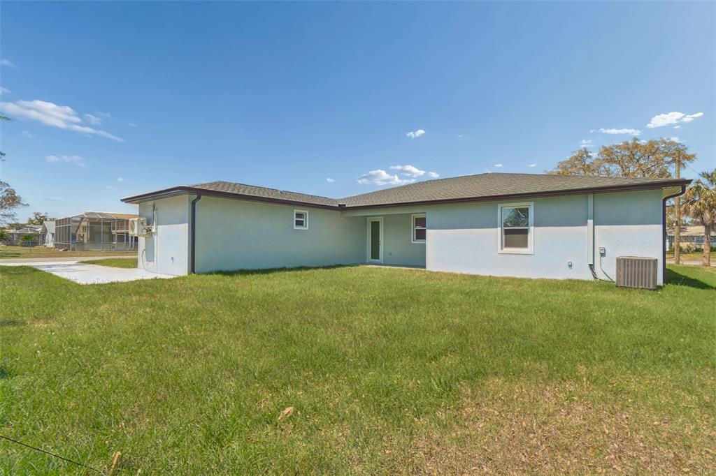 6018 Newmark Street Spring Hill, FL 34606 - Photo 19 of 26 a house view with a outdoor space