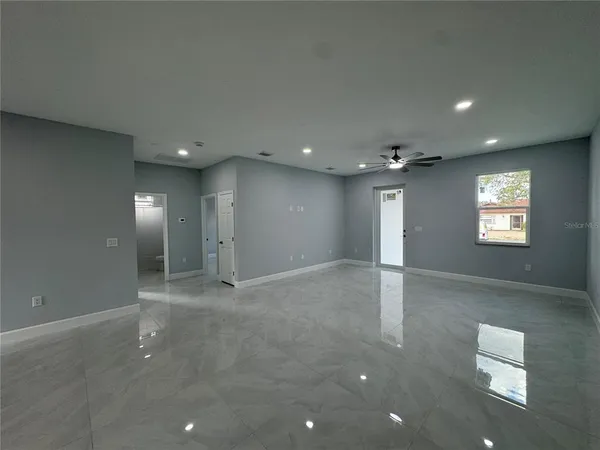 a kitchen with stainless steel appliances granite countertop a sink and a stove top oven