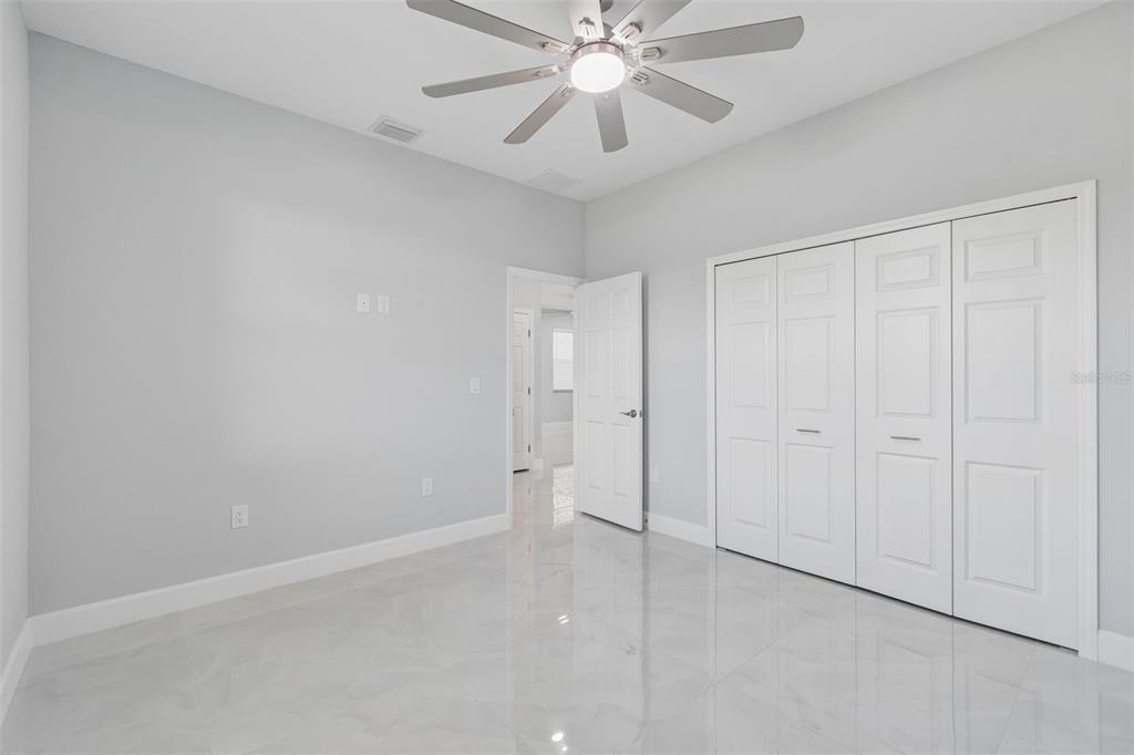 6018 Newmark Street Spring Hill, FL 34606 - Photo 9 of 26 wooden floor in an empty room