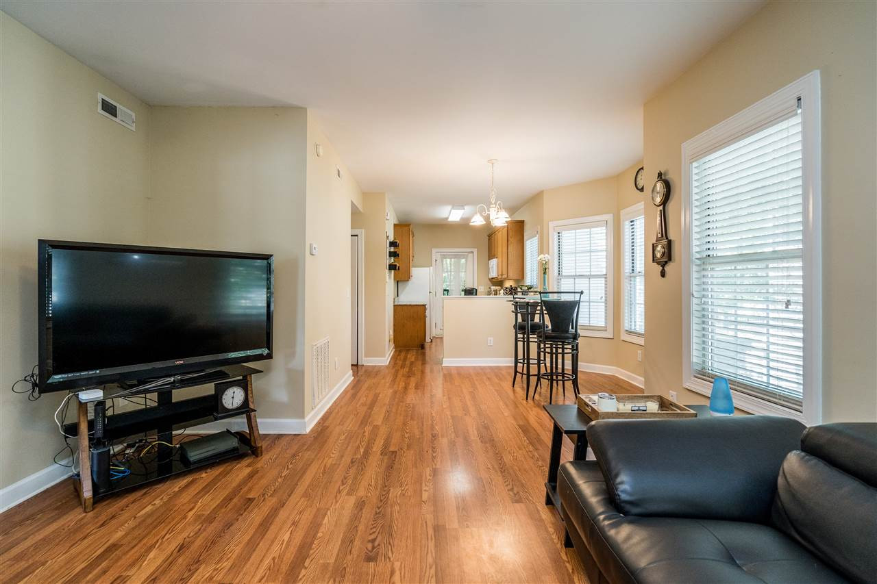 7016 Sandy Forks Road, Unit 201 Raleigh, NC 27609 - Photo 8 of 28 Living room flows into kitchen and dining for a spacious feel! Living Room