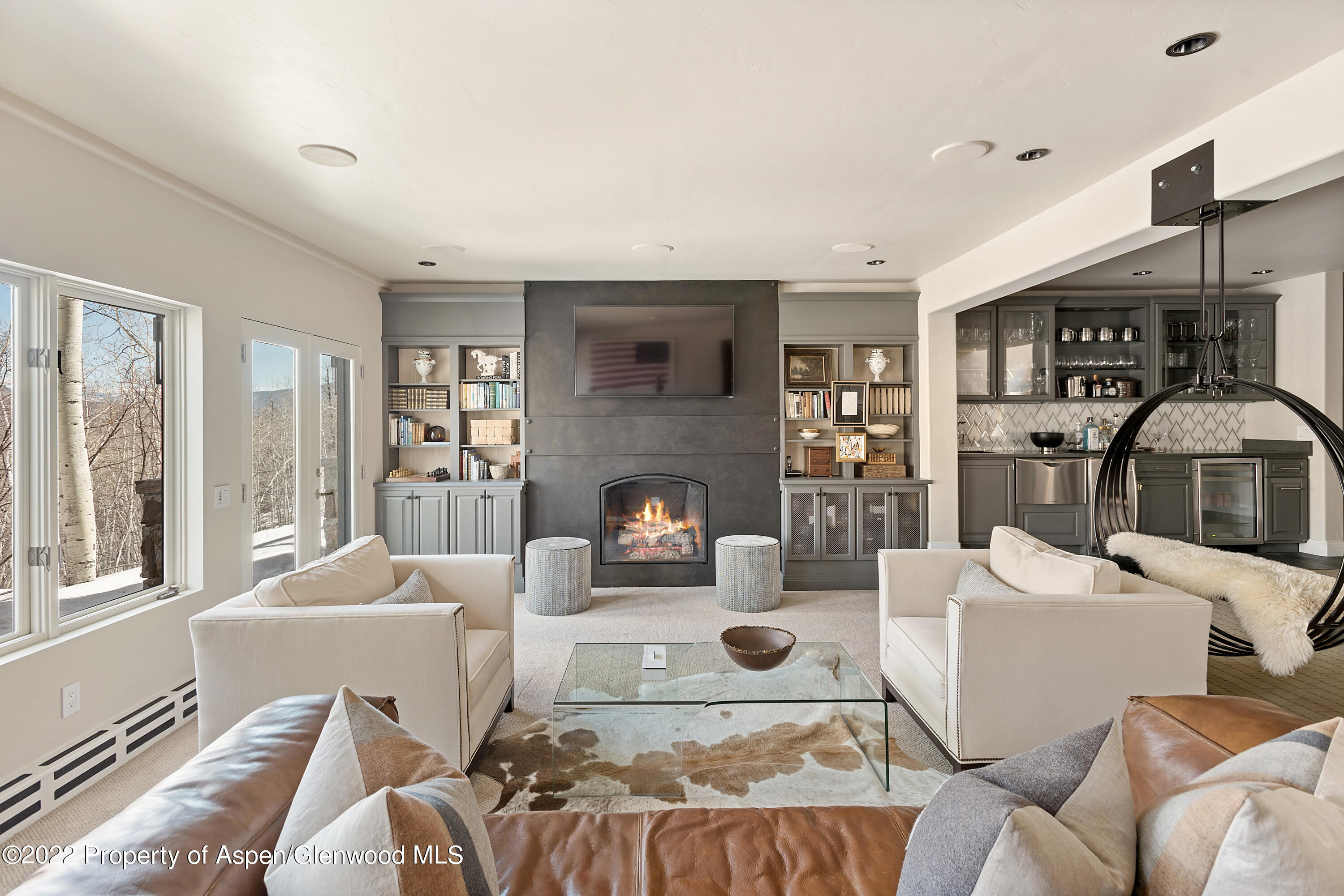 399 Maple Ridge Lane Snowmass Village, CO 81615 - Photo 13 of 27 a living room with furniture and a fireplace