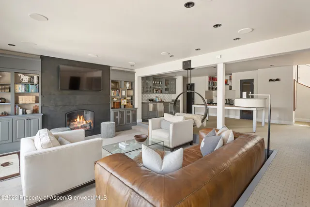a view of a livingroom with furniture and a table