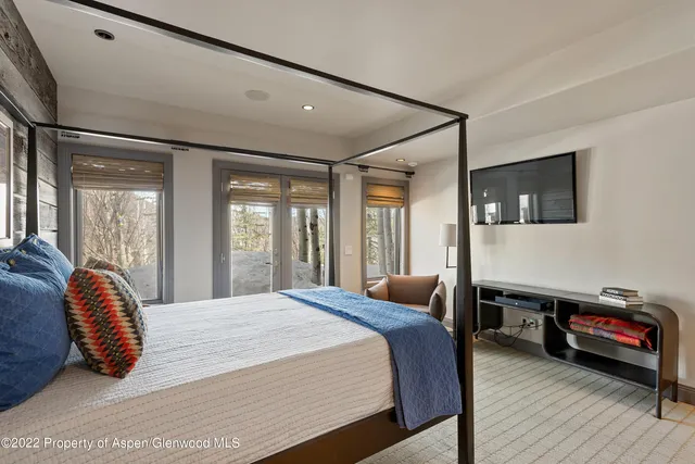 a bedroom with a bed and cabinets