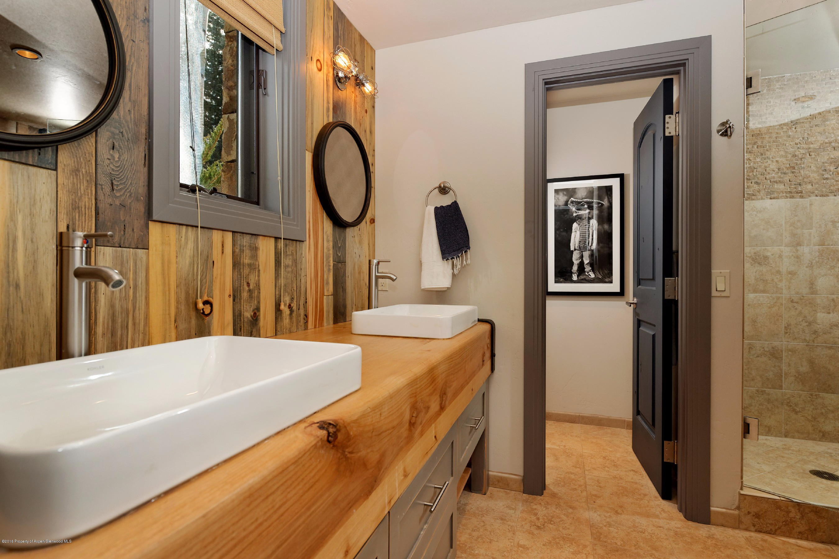399 Maple Ridge Lane Snowmass Village, CO 81615 - Photo 20 of 27 a bathroom with a tub sink and mirror