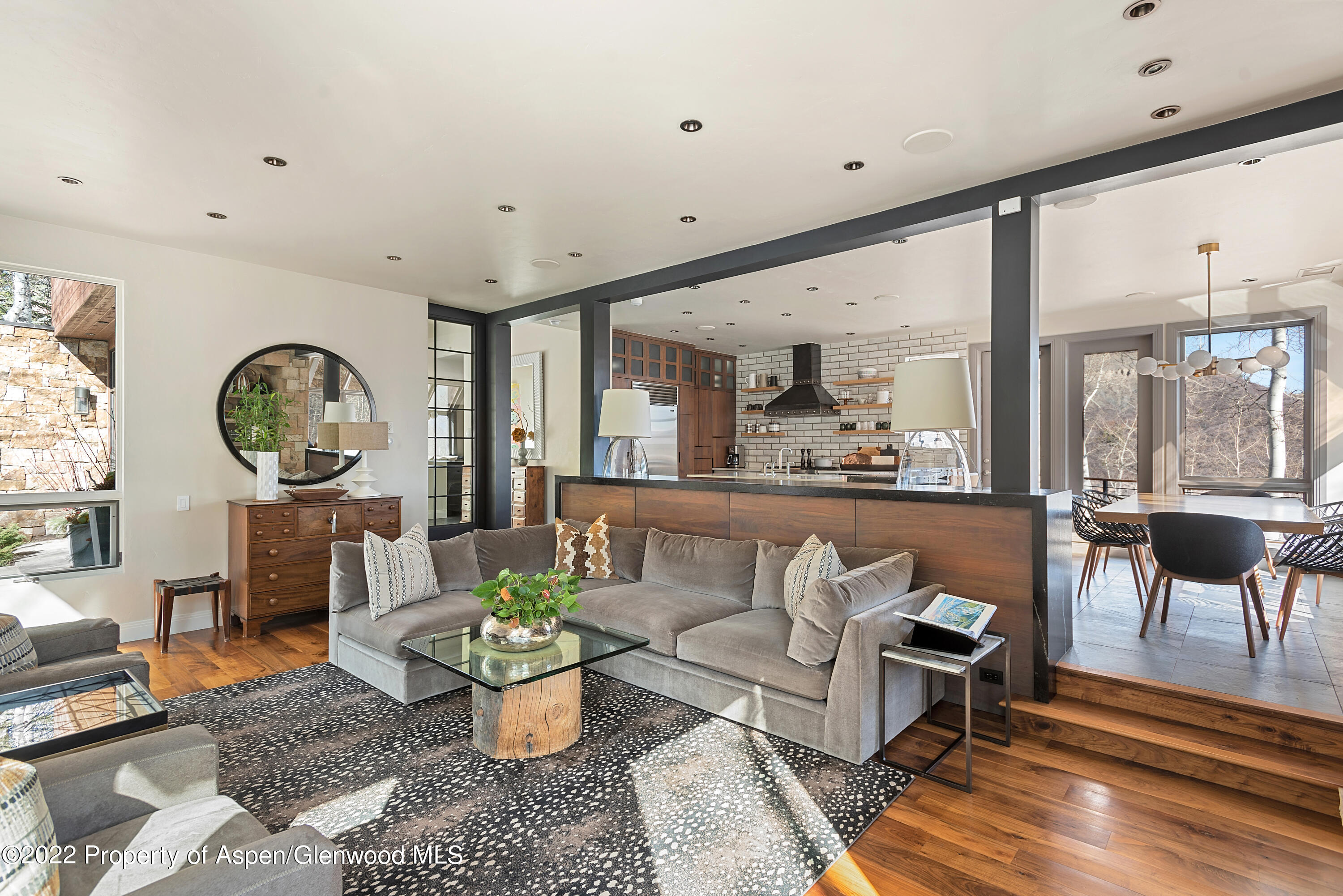 399 Maple Ridge Lane Snowmass Village, CO 81615 - Photo 2 of 27 a living room with furniture and a large window