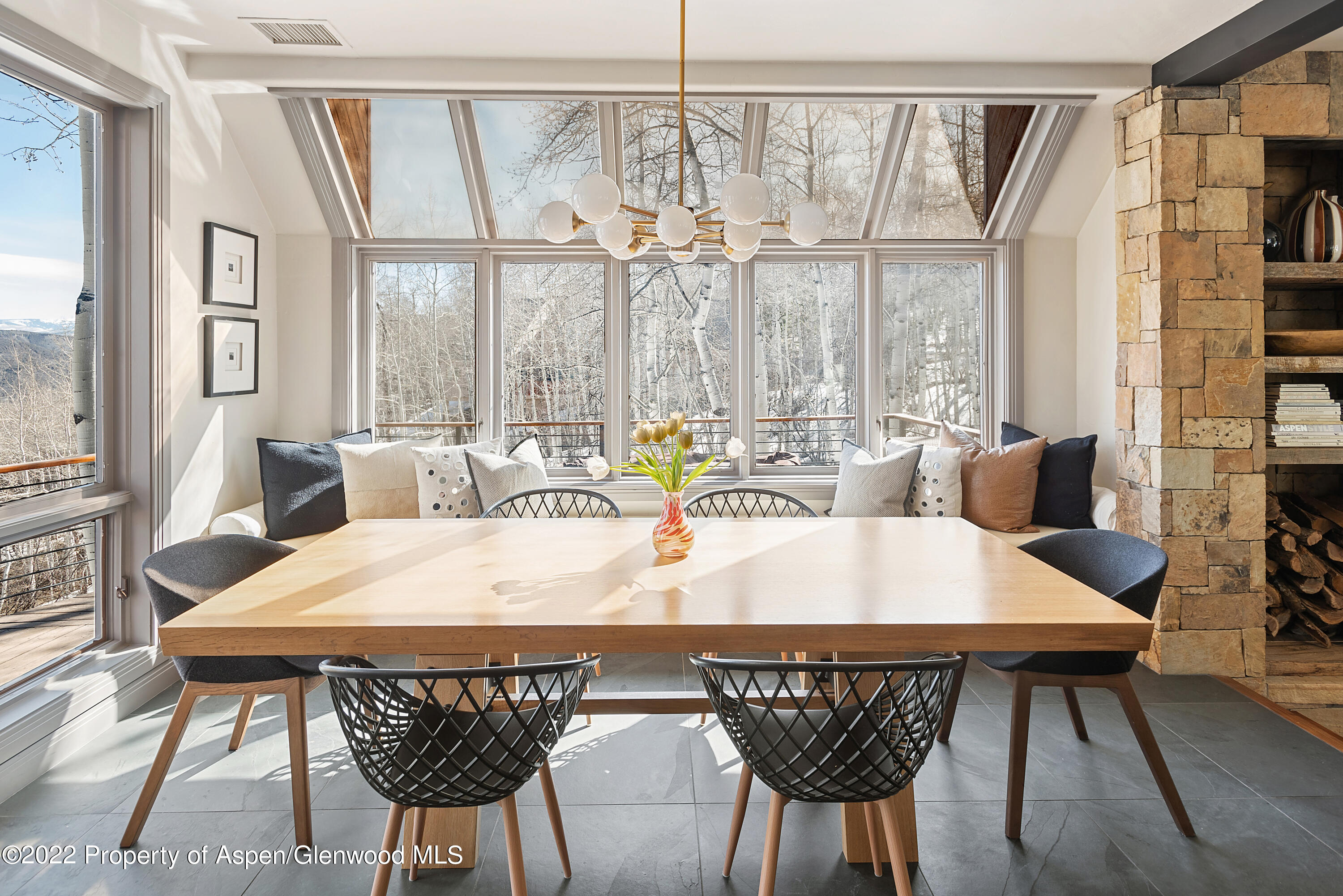 399 Maple Ridge Lane Snowmass Village, CO 81615 - Photo 7 of 27 a view of a dining room with furniture window and wooden floor