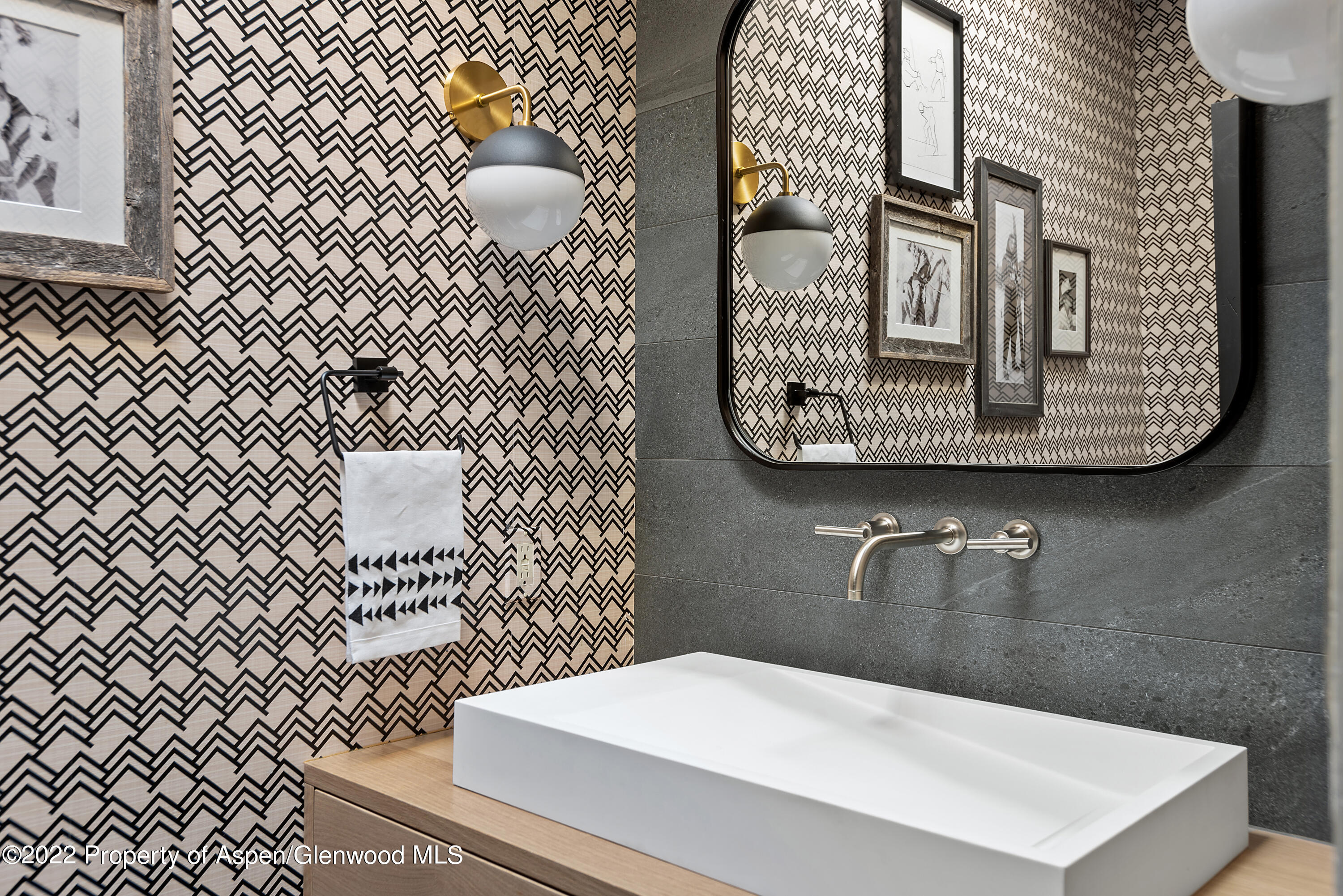 399 Maple Ridge Lane Snowmass Village, CO 81615 - Photo 8 of 27 a bathroom with a sink a toilet and mirror