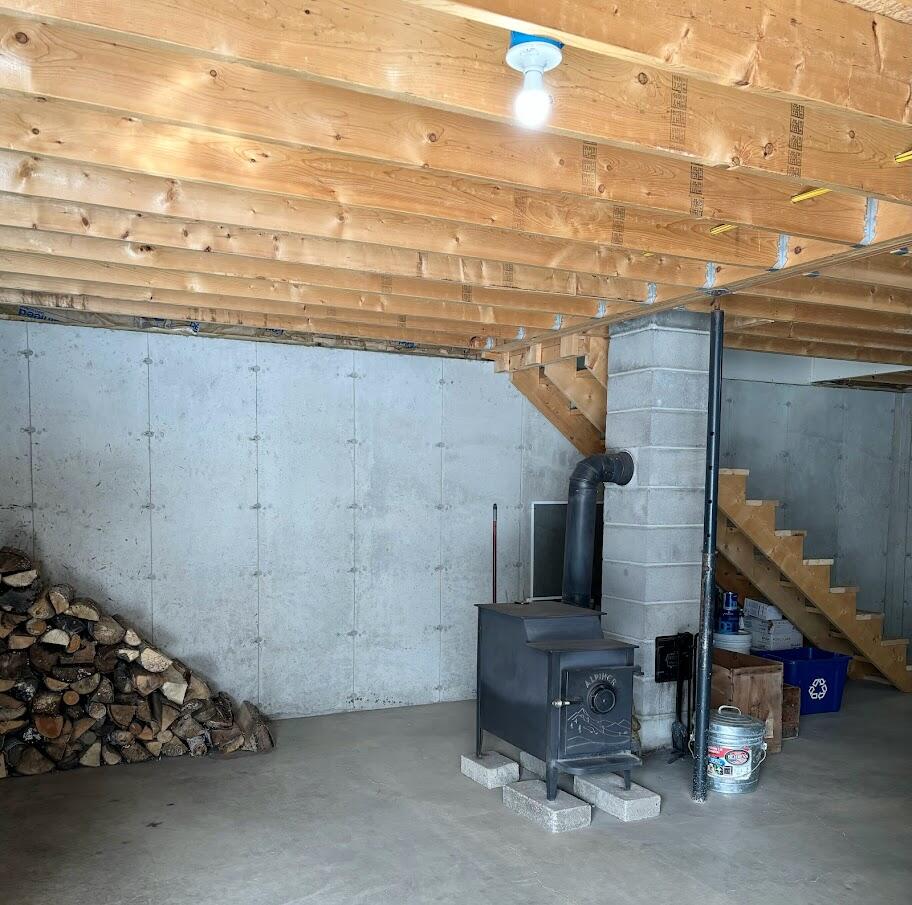 996 Medford Center Road Medford, ME 04463 - Photo 20 of 24 Basement Wood Stove
