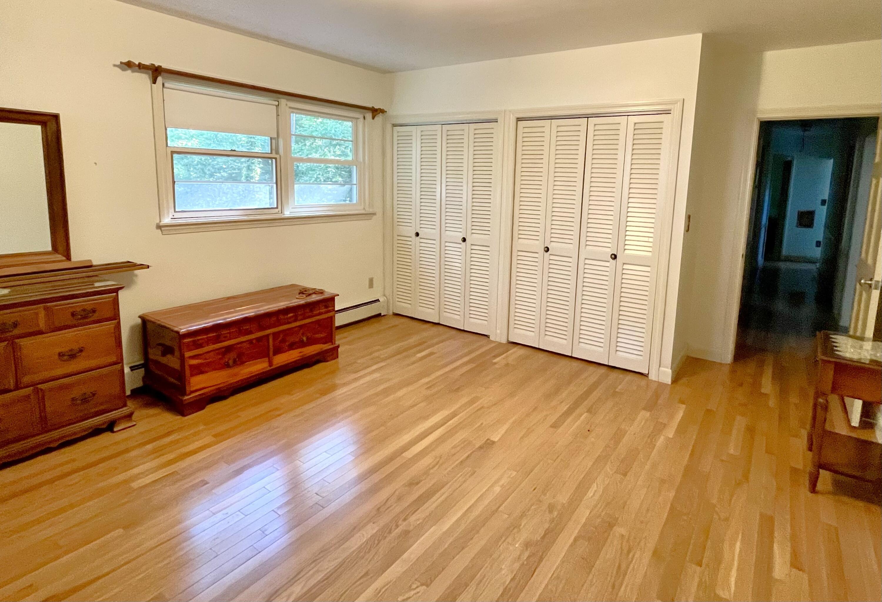 73 Tern Lane Centerville, MA 02632 - Photo 11 of 31 a room with wooden floor and furniture